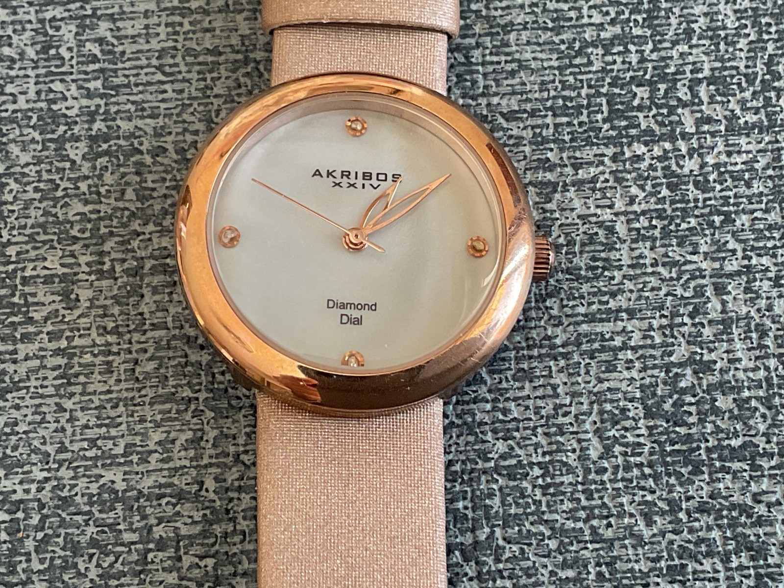 Akribos xxiv Diamond Dial woman’s wristwatch minimalist numberless