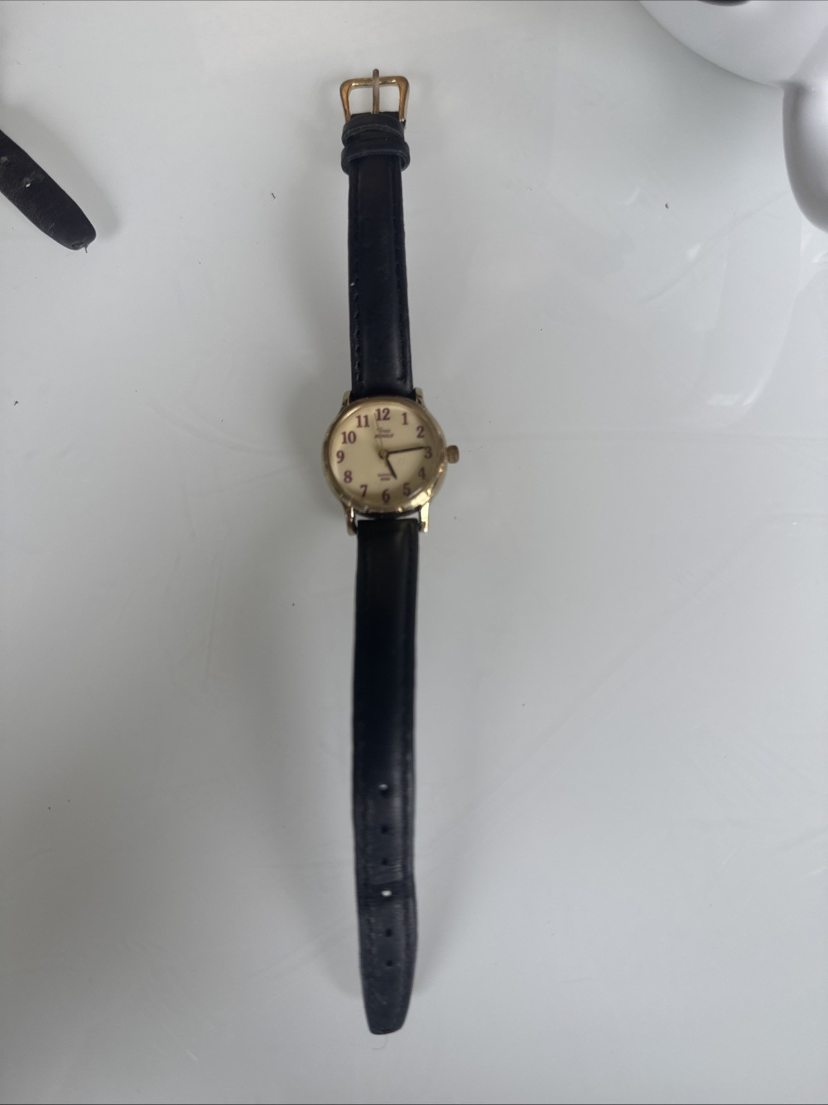 timex woman’s gold face black leather indiglo dark red numbers water proof