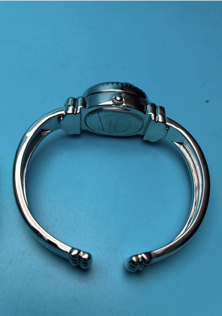 Gem Essence silver-tone watch features a distinct purple druzy stone