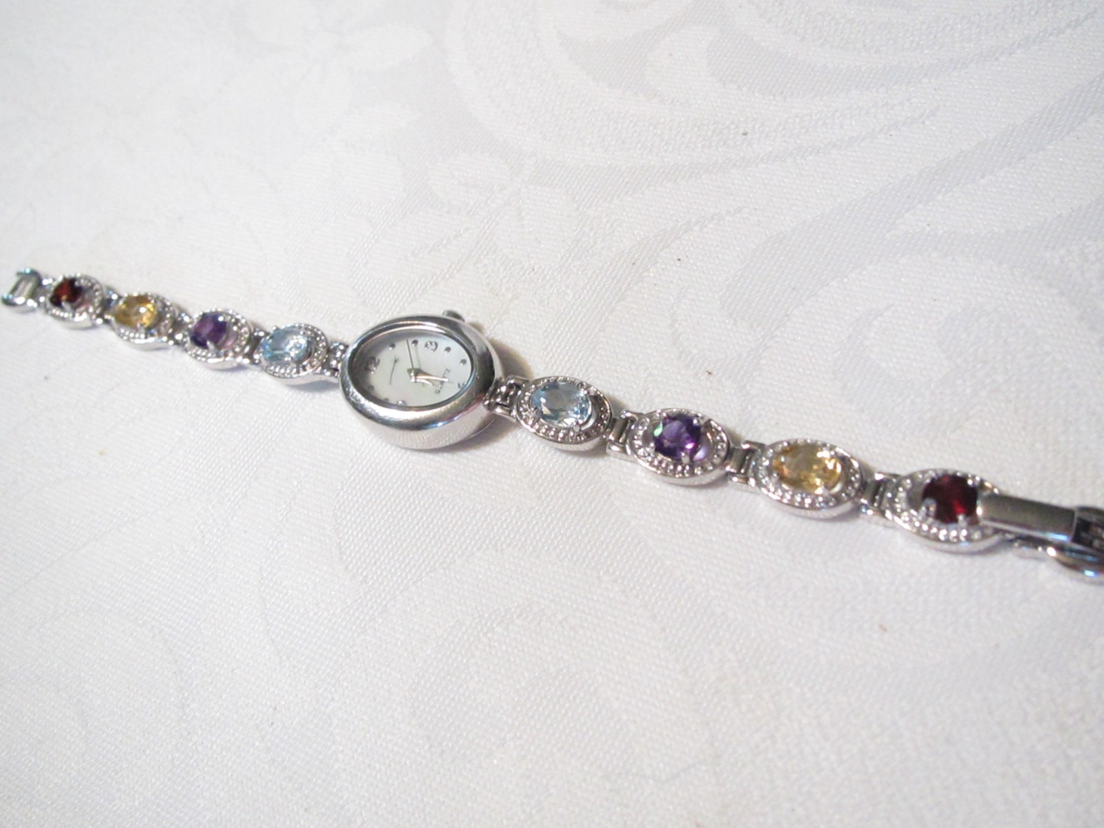 BEAUTIFUL STERLING SILVER MULTI GENUINE GEMSTONES 7 1/4″ QUARTZ WATCH – 29.6 GR.