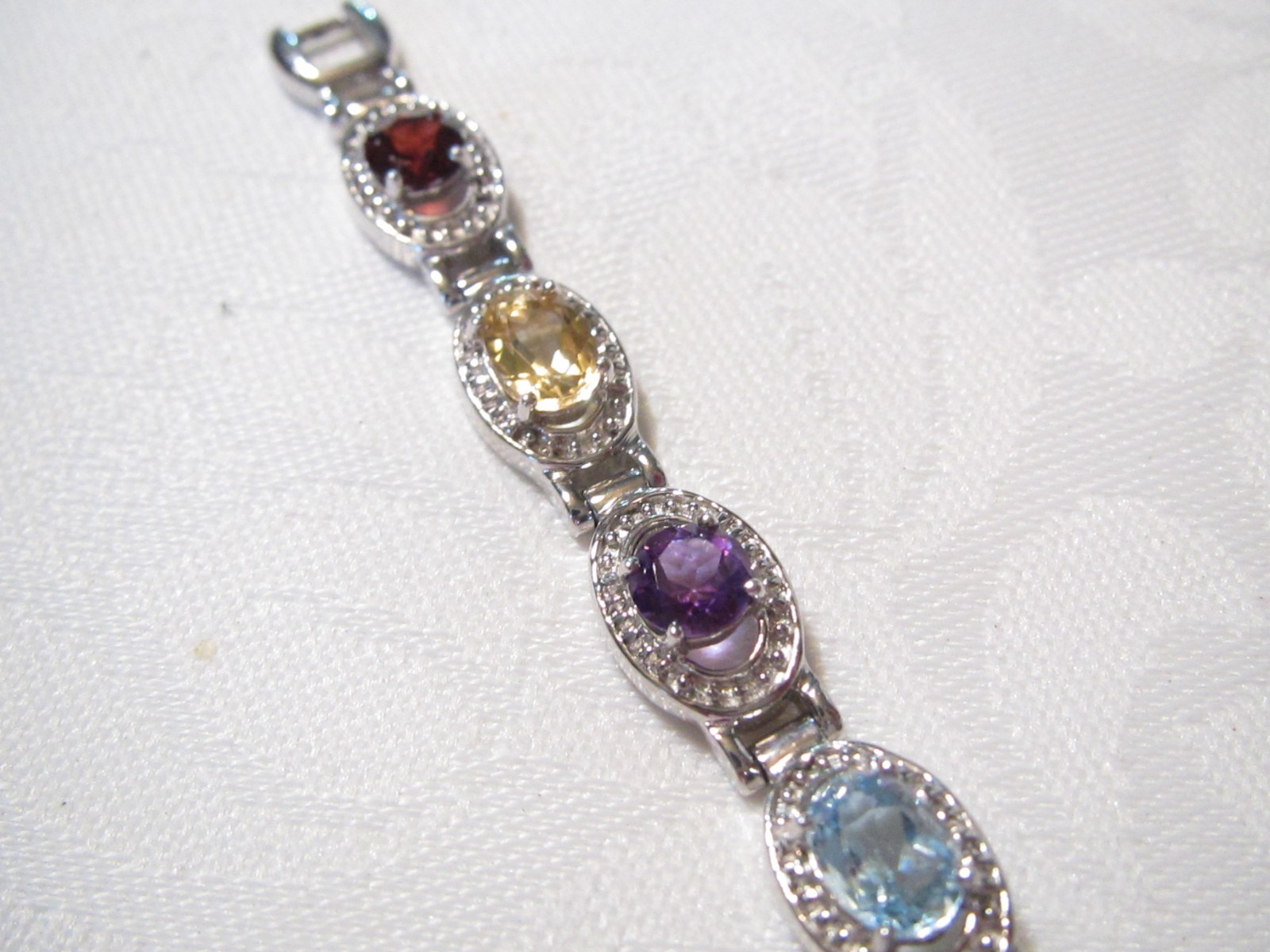 BEAUTIFUL STERLING SILVER MULTI GENUINE GEMSTONES 7 1/4″ QUARTZ WATCH – 29.6 GR.