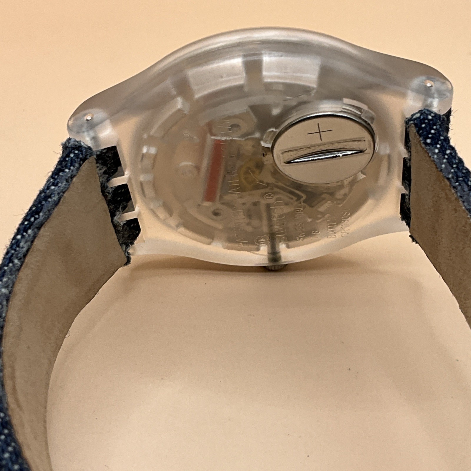 Swatch AG-2012 Clear Case Silver Dial with Denim/Leather Band – New Battery