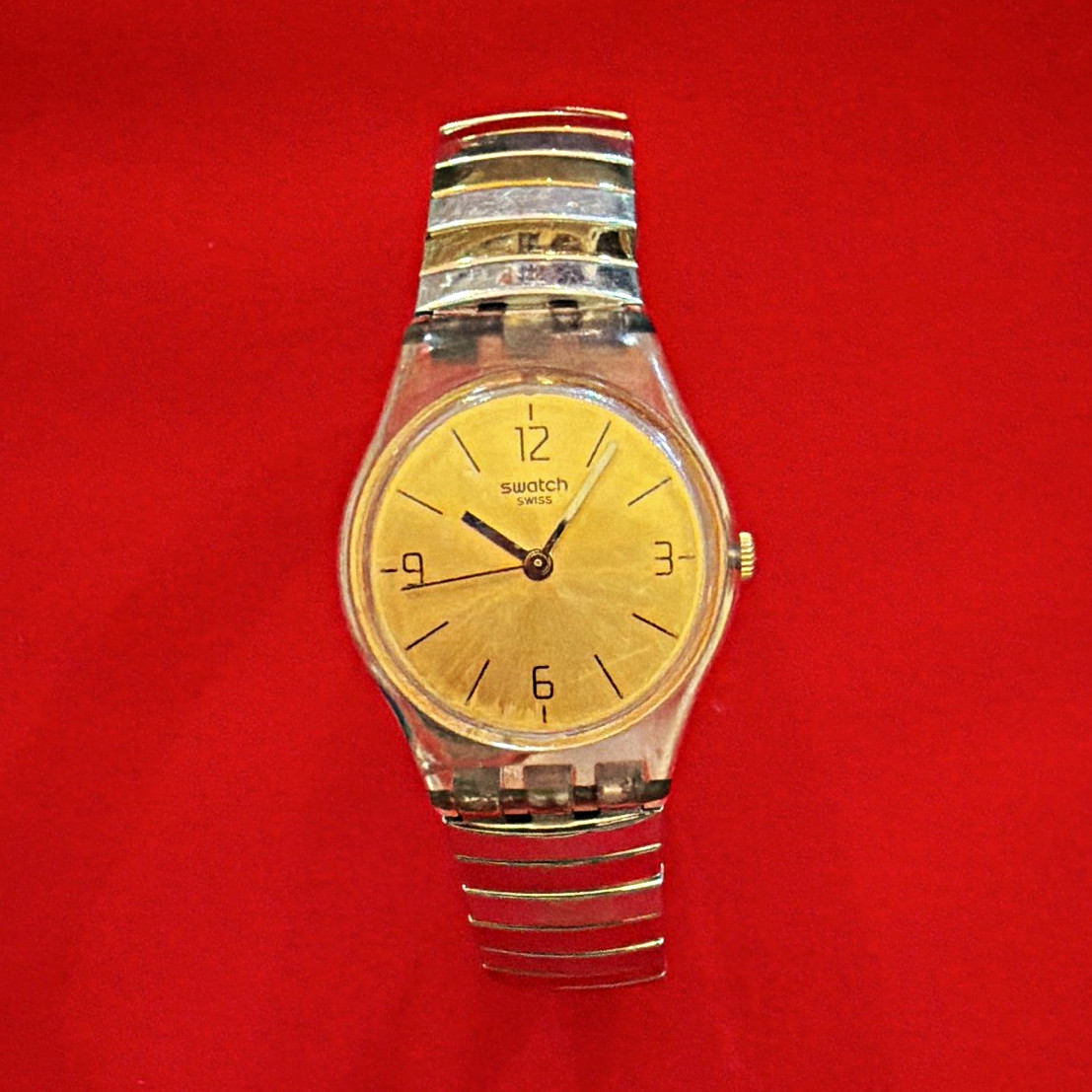 Swatch Quartz Analog Watch Gold Dial Clear Case Silver Metal Bracelet