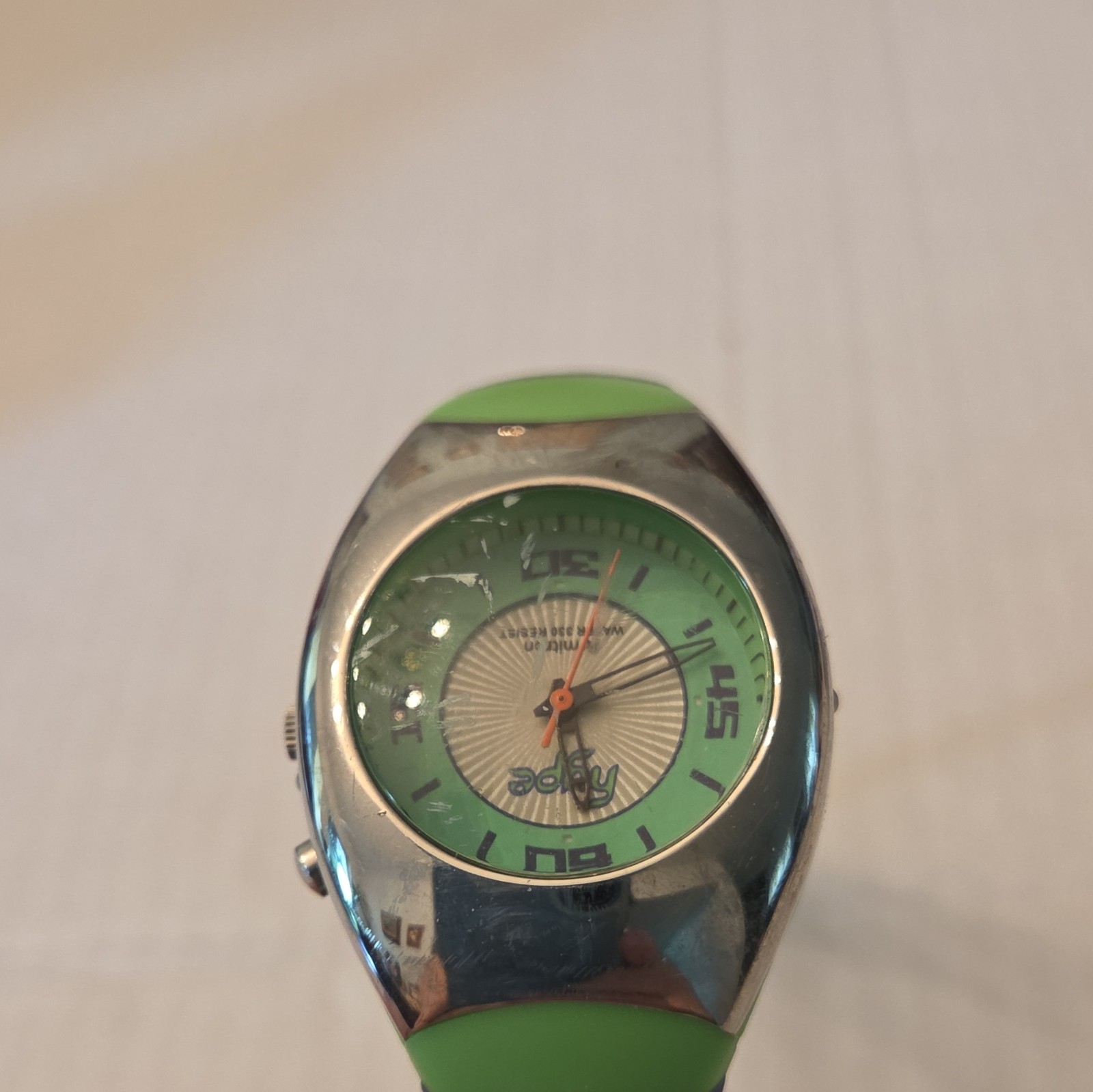 Green & Silver Dial Oval Wristwatch, Black Band, Silver Case, Arabic Numerals