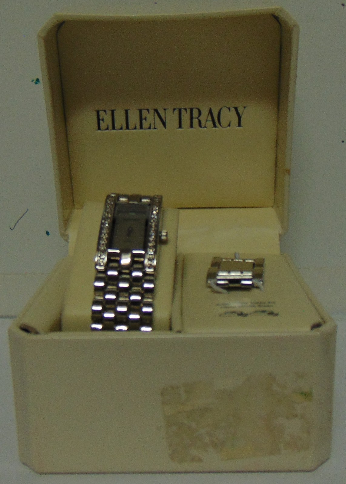 ELLEN TRACY Silver Tone, Clear Rhinestones, and White Face Oblong Wristwatch