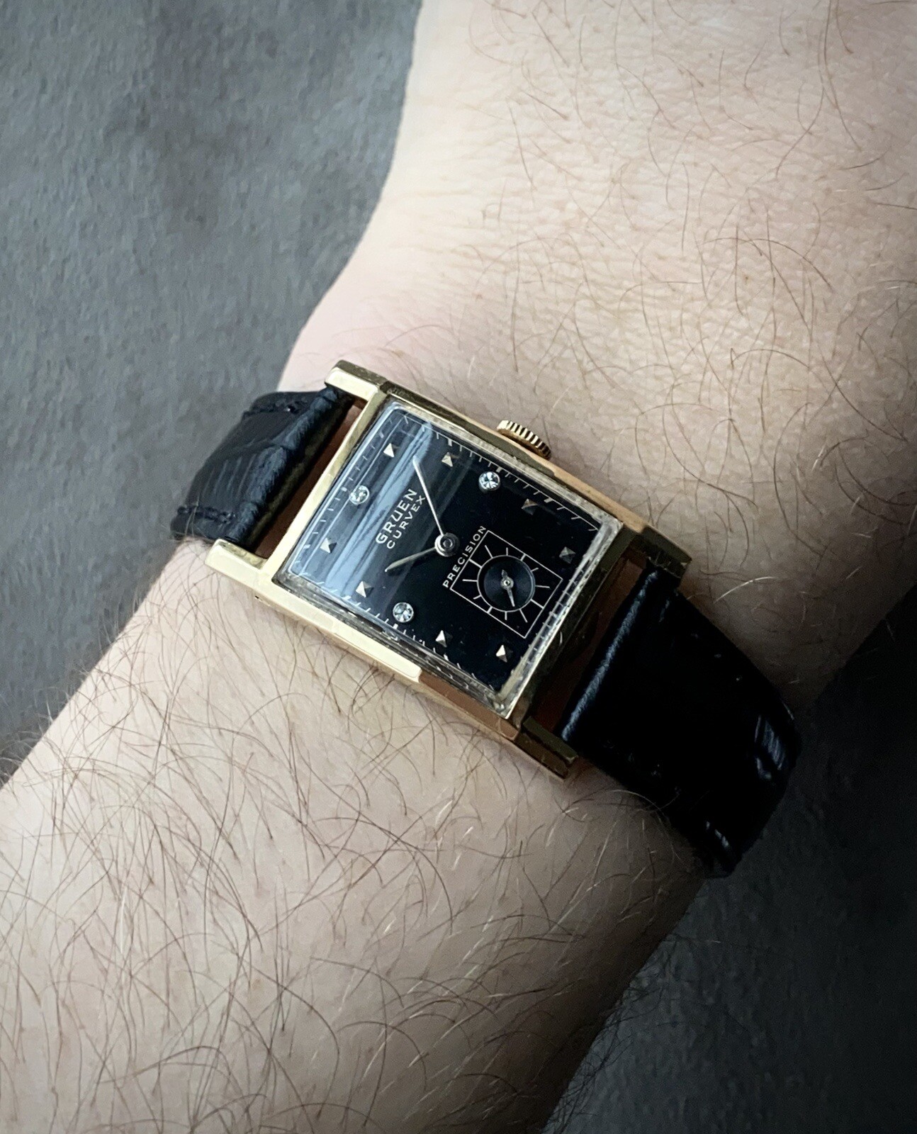 1940s Gruen Curvex Precision 14k gold cased watch with black diamond dial