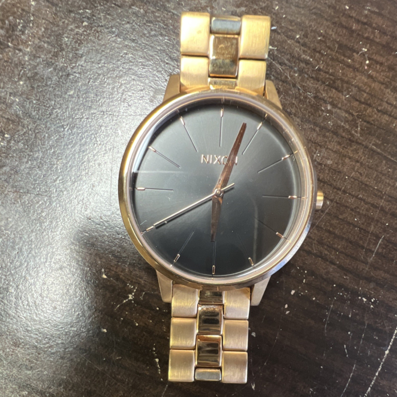 Nixon Gold Tone Analog Wristwatch Black Dial Stick Indexes Metal