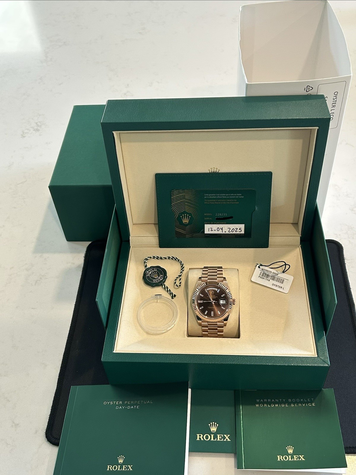 Rolex Day-Date 228235 40mm Rose Gold Chocolate Dial with Diamond Baguettes 2025