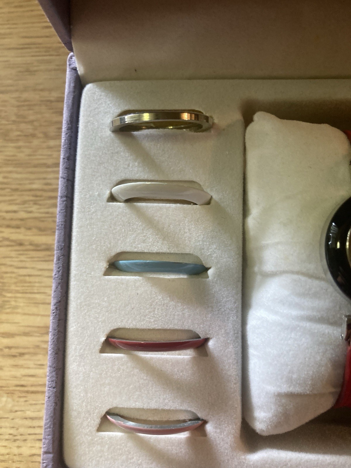 This is a St George watch set with interchangeable bands and bezels