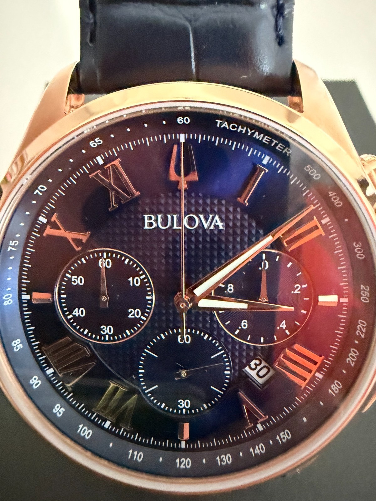 Bulova Men’s Classic Wilton 3-Hand Chronograph Watch, Rose Gold with Blue Band