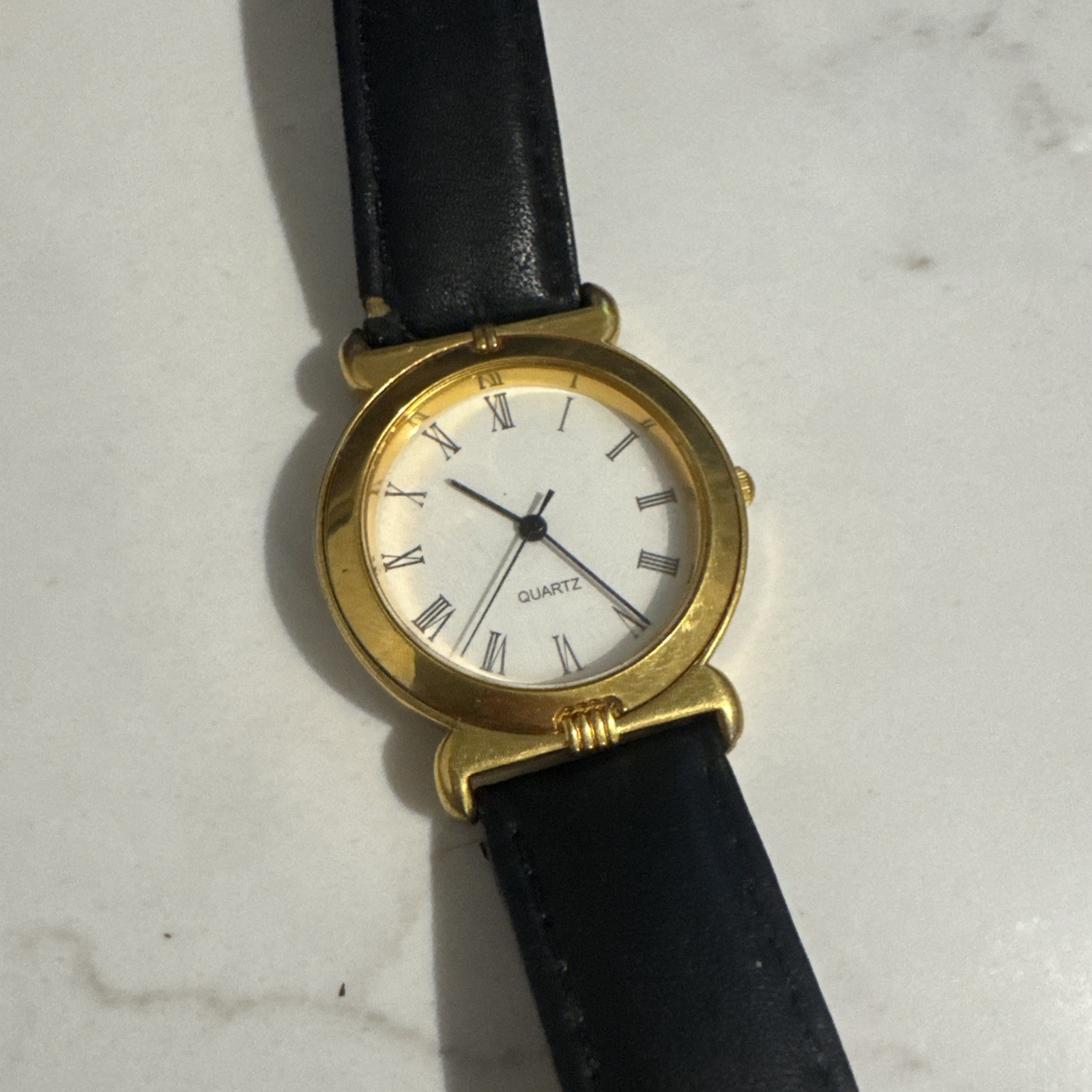 Unbranded 34mm Gold Tone White Dial Quartz Watch Black Leather Band