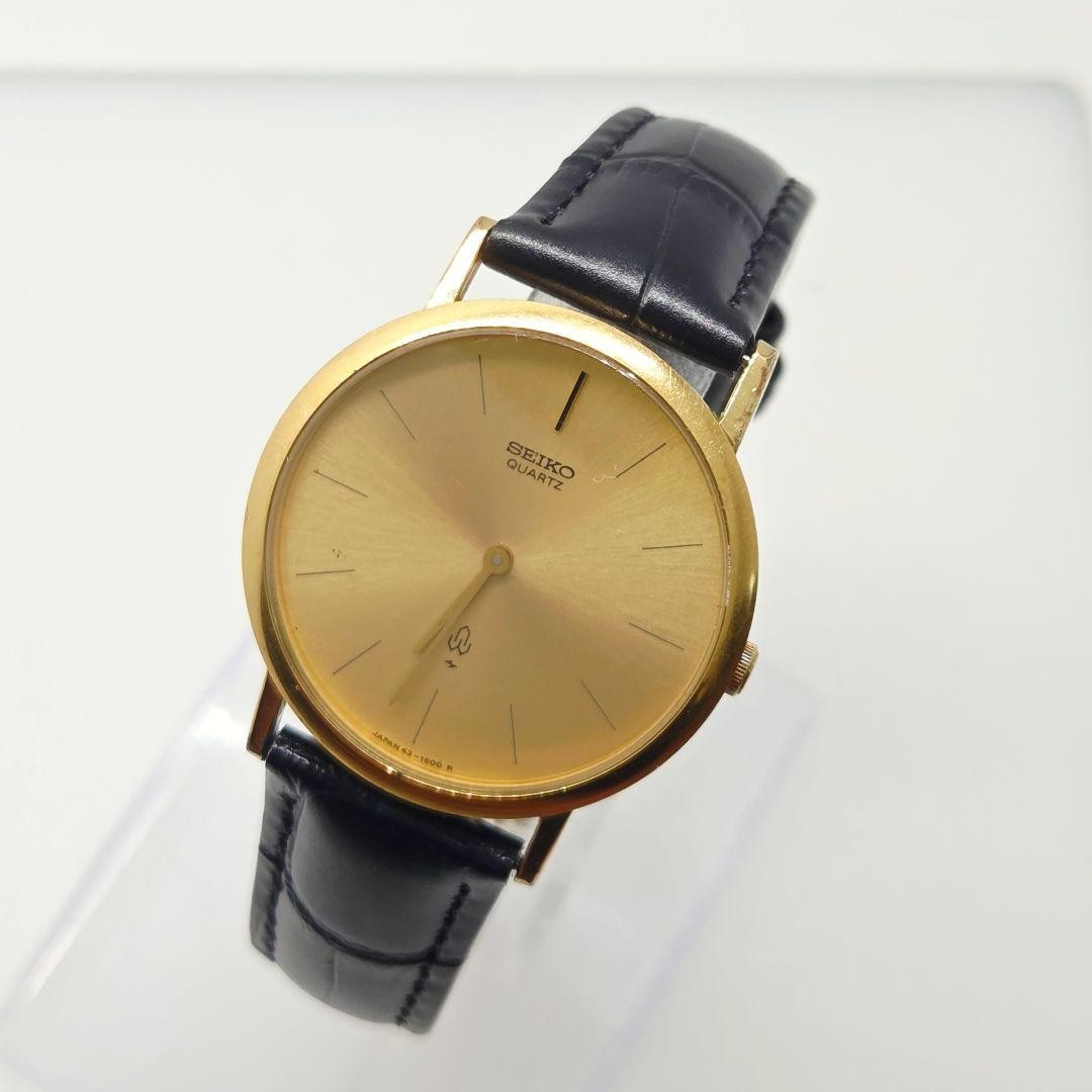 Seiko Gold Tone Thin Dress Watch Gold Dial Leather Band 63-1600