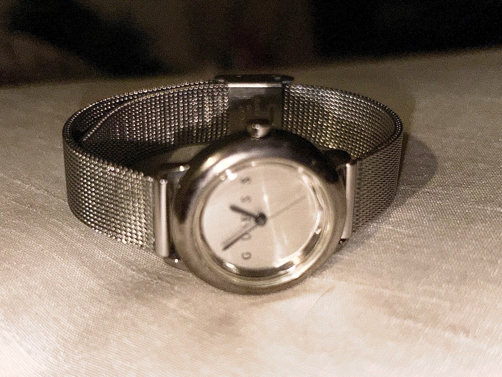 1996 GUESS numberless face watch. silver w adjustable mesh band. new battery.