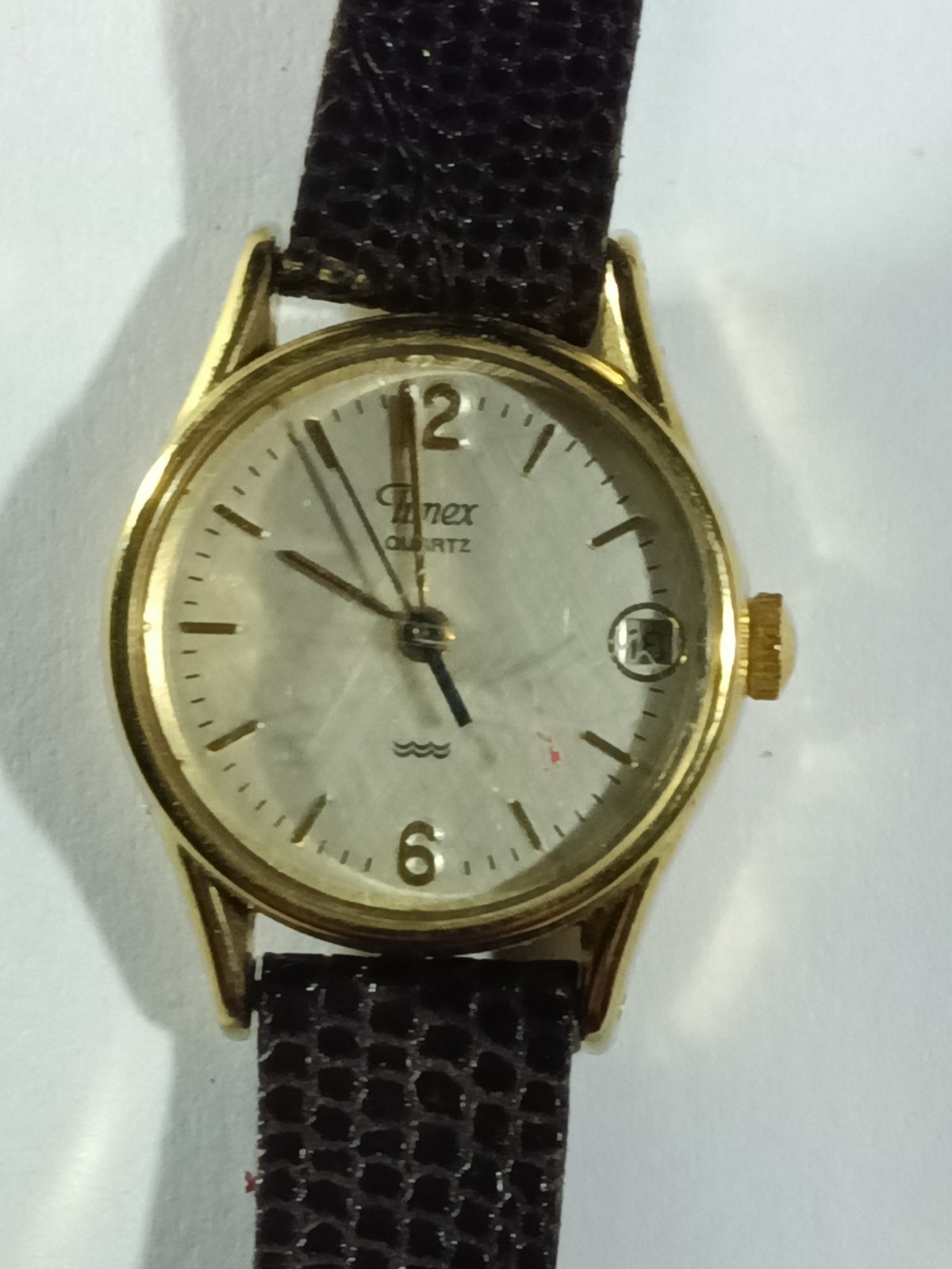 Classic Timex Quartz Analog Watch with a Gold-Tone Round Case