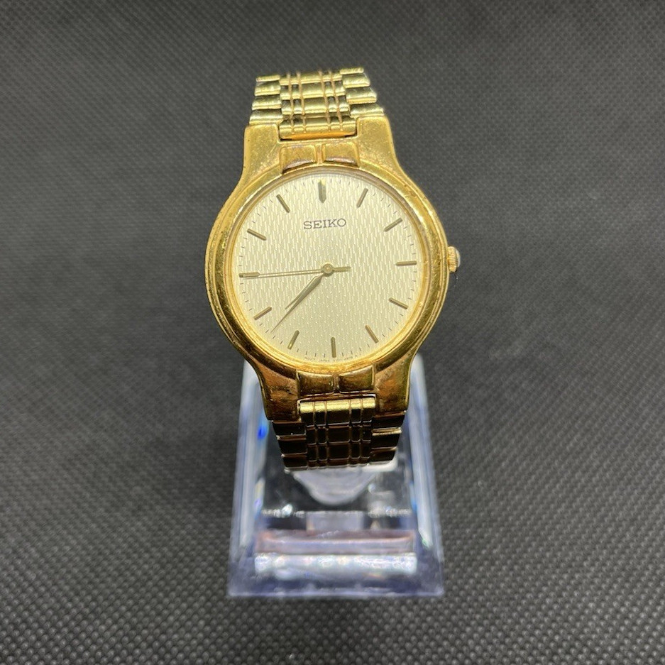 Seiko Quartz Gold Tone Metal Bracelet Textured Gold Stick Dial