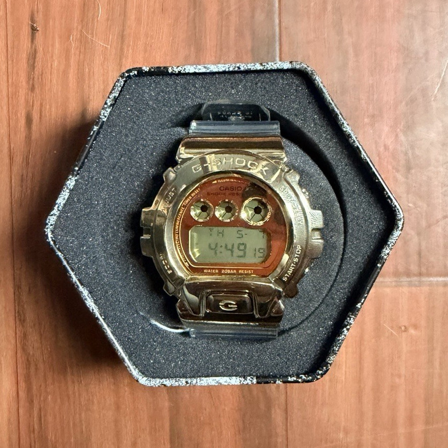 Casio G-SHOCK Digital Quartz Gold Tone w/ Clear Resin Band 200m Tin Box