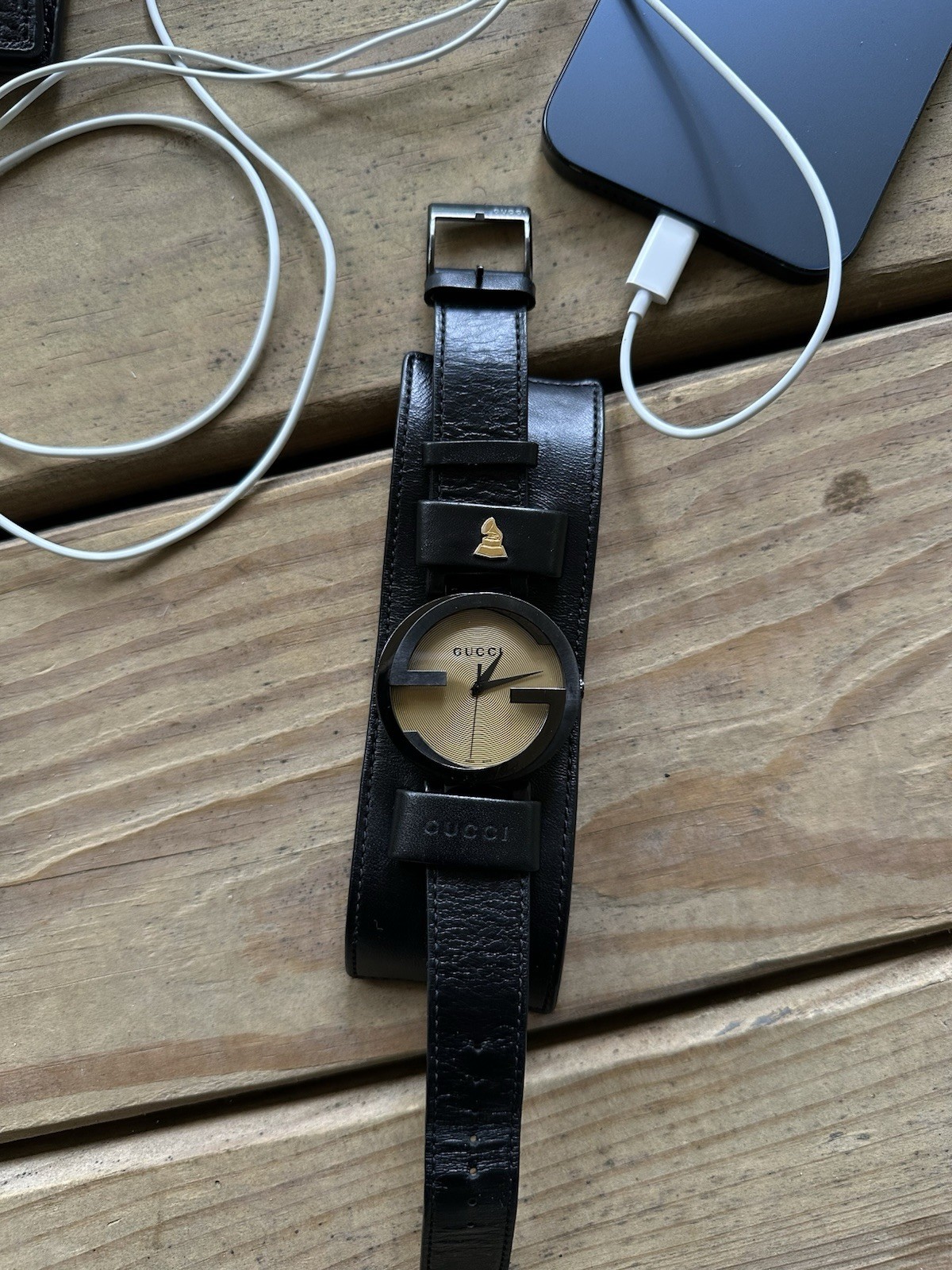 Gucci Grammy Awards Quartz Analog Watch Gold Dial Black Leather Strap