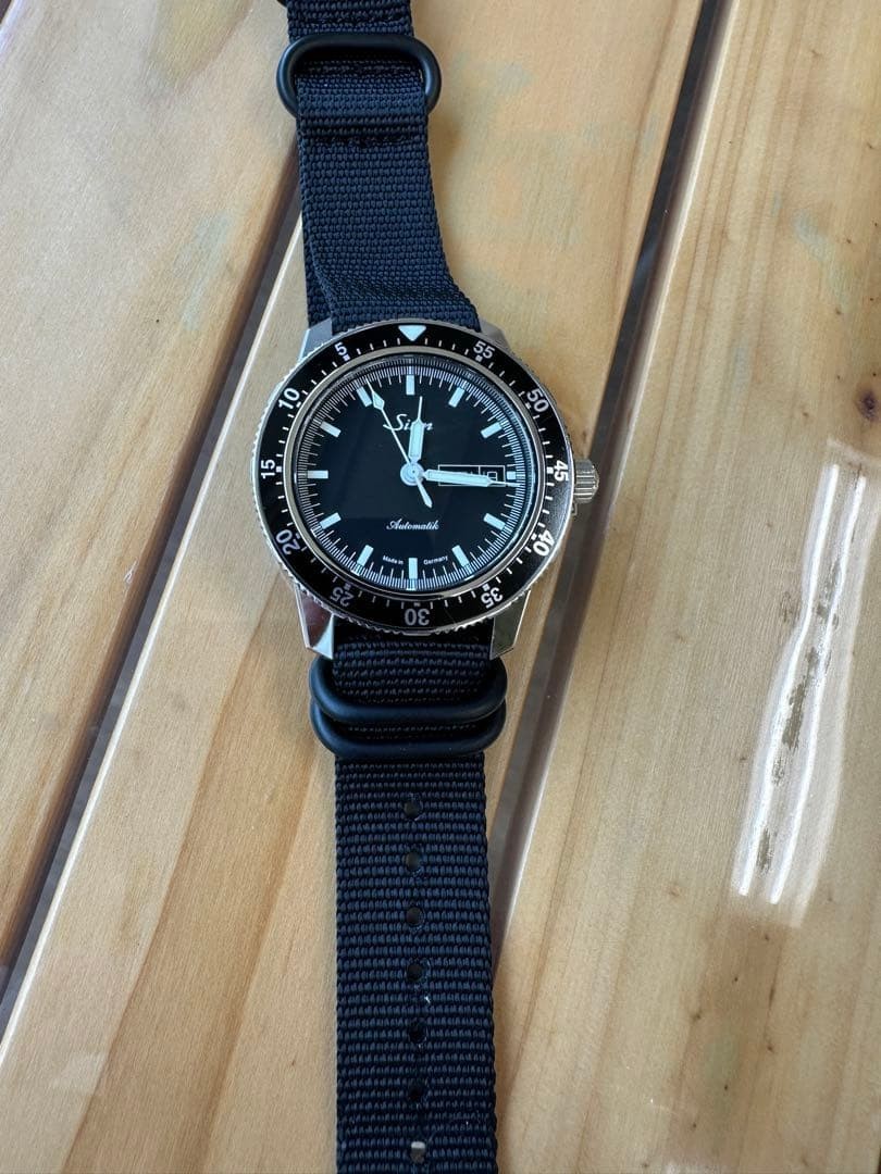 Sinn 104.ST.SA, black dial; includes box and papers, as well as spare links for
