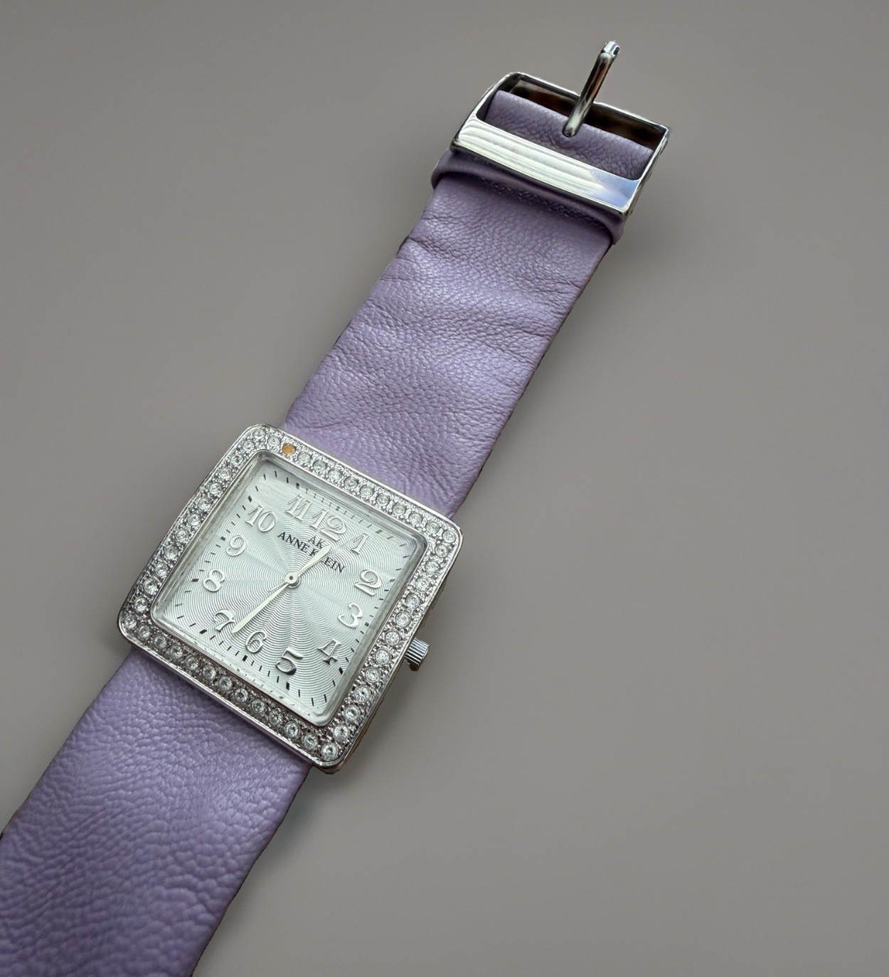 Anne Klein Women’s Quartz Square Silver Dial Arabic Numerals Purple Strap Gem
