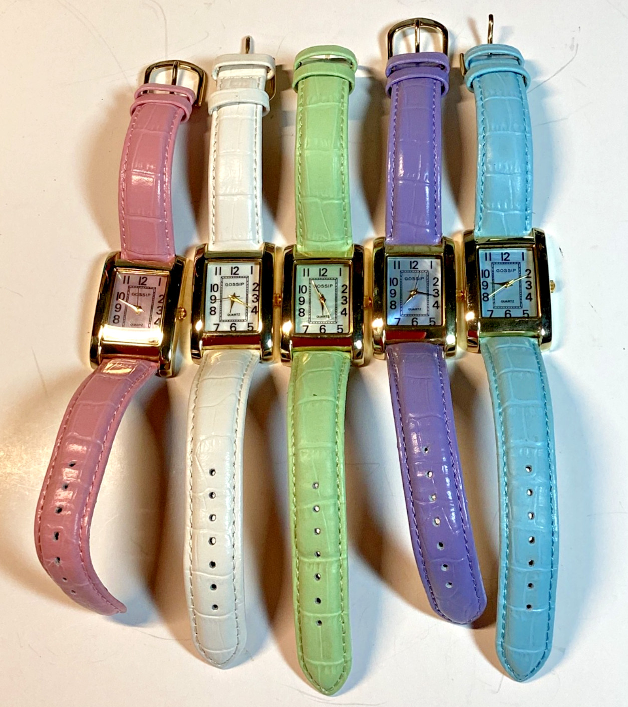 Gossip Watch Womens Gold Tone Case M of P Face Pink Purple White Blue Green