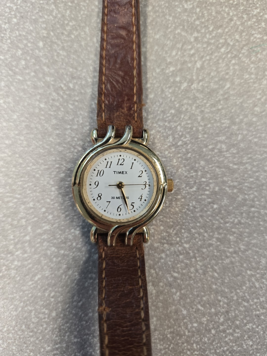 Timex 30 meters women’s leather and gold watch
