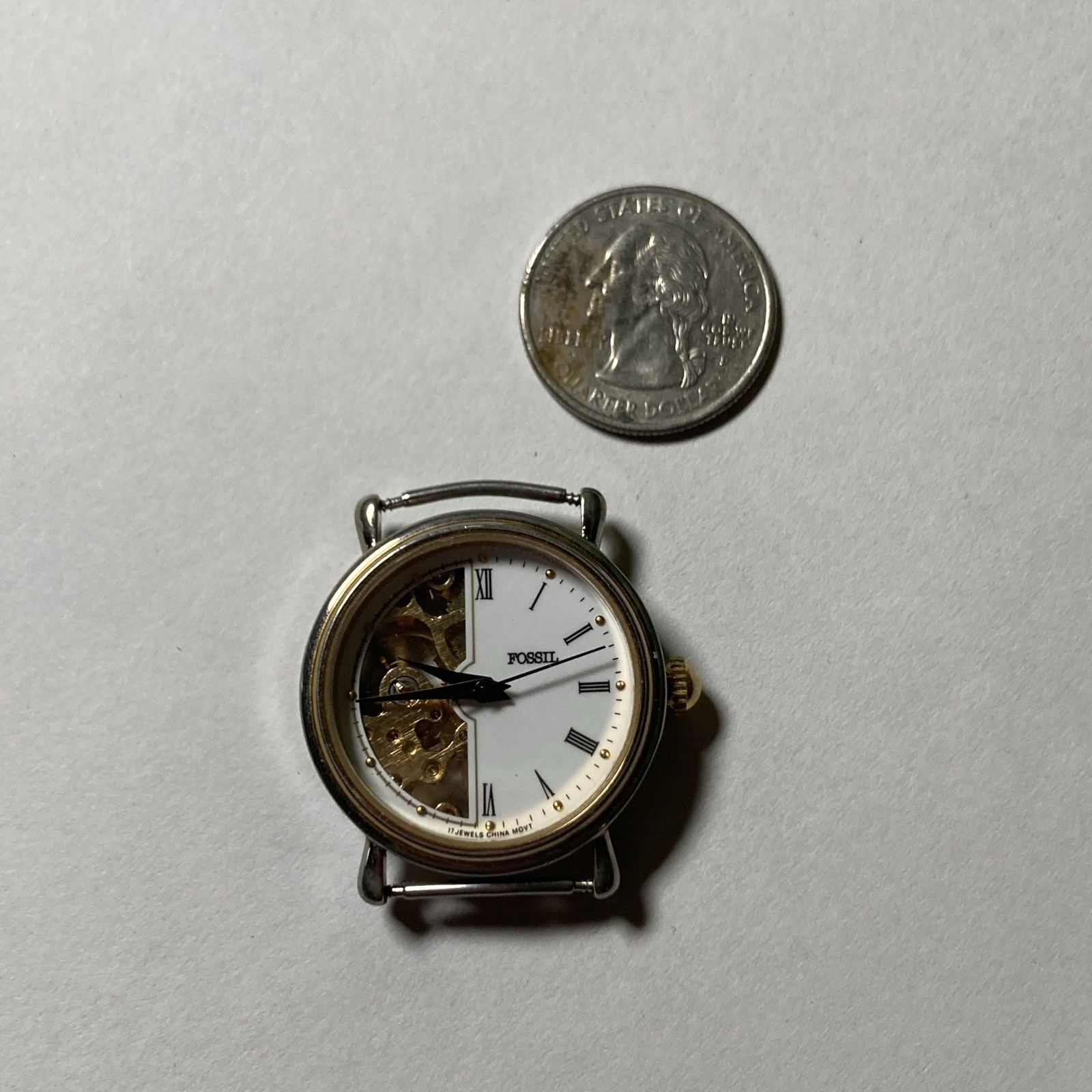 Fossil Mechanical Skeleton Dial Roman Numerals Gold and Silver Watch