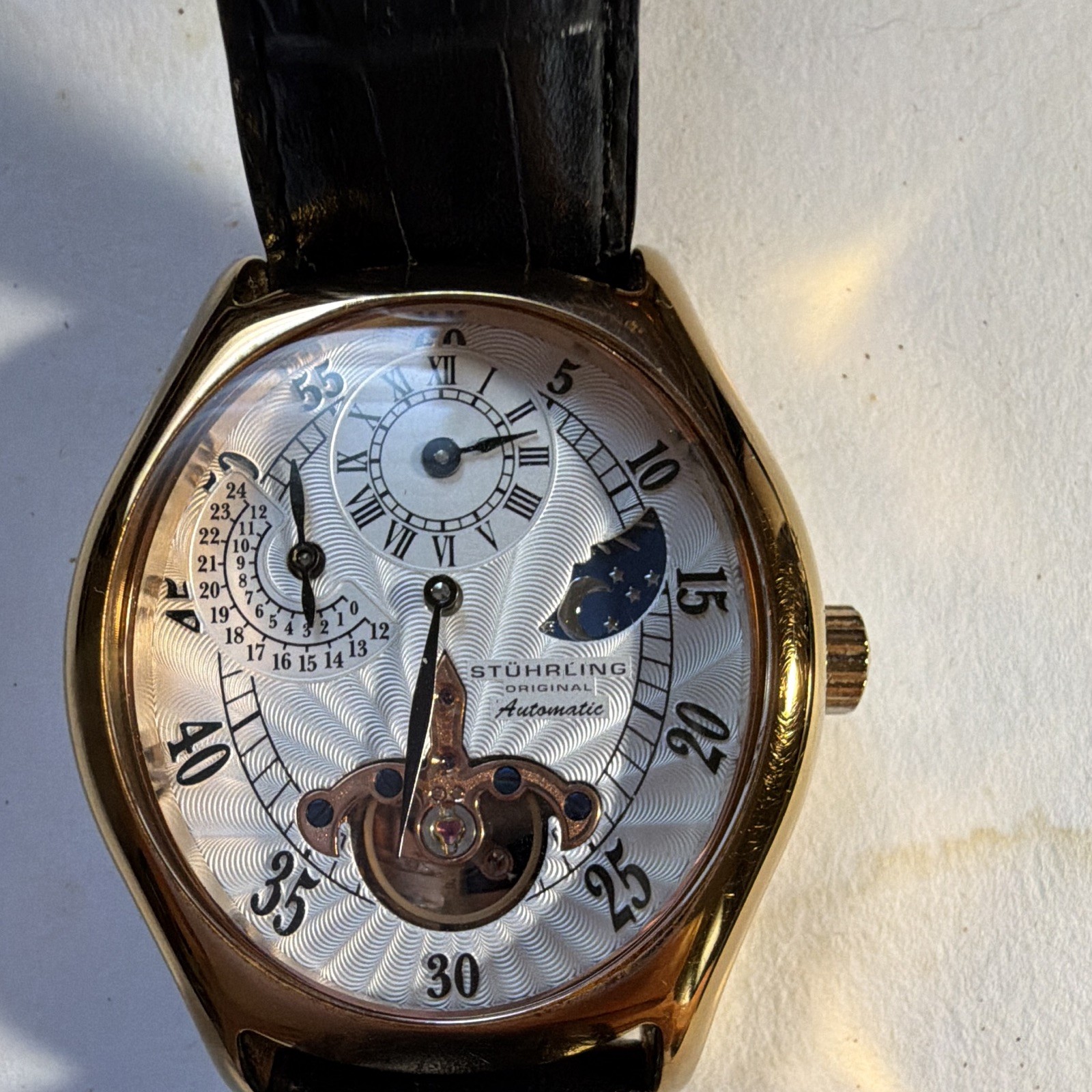 Stührling Original Automatic Tonneau Gold Tone Moon Phase Black Leather Strap