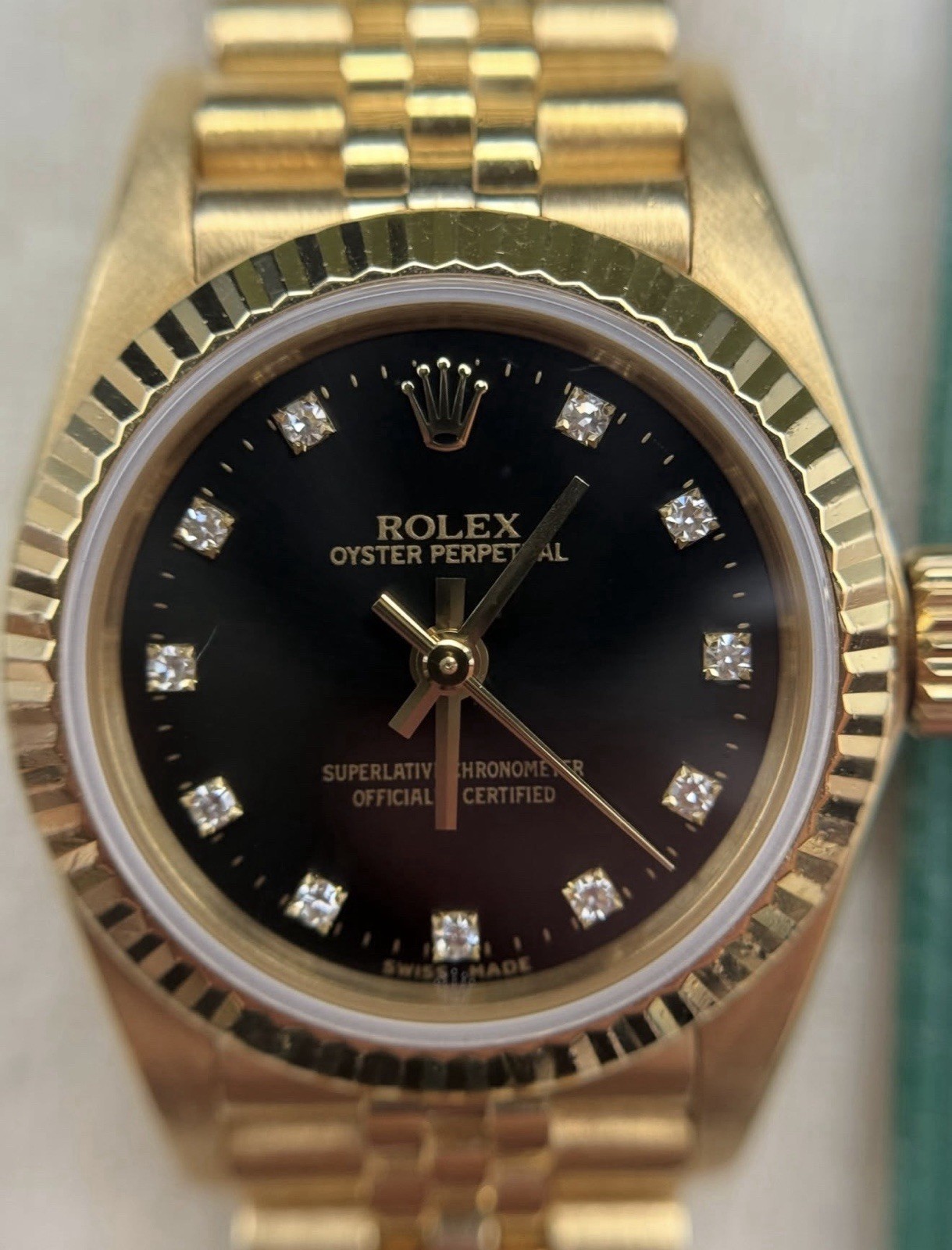 Rolex Oyster Perpetual 67198 26mm 18k Gold Black Diamond Dial Auto Women’s Watch