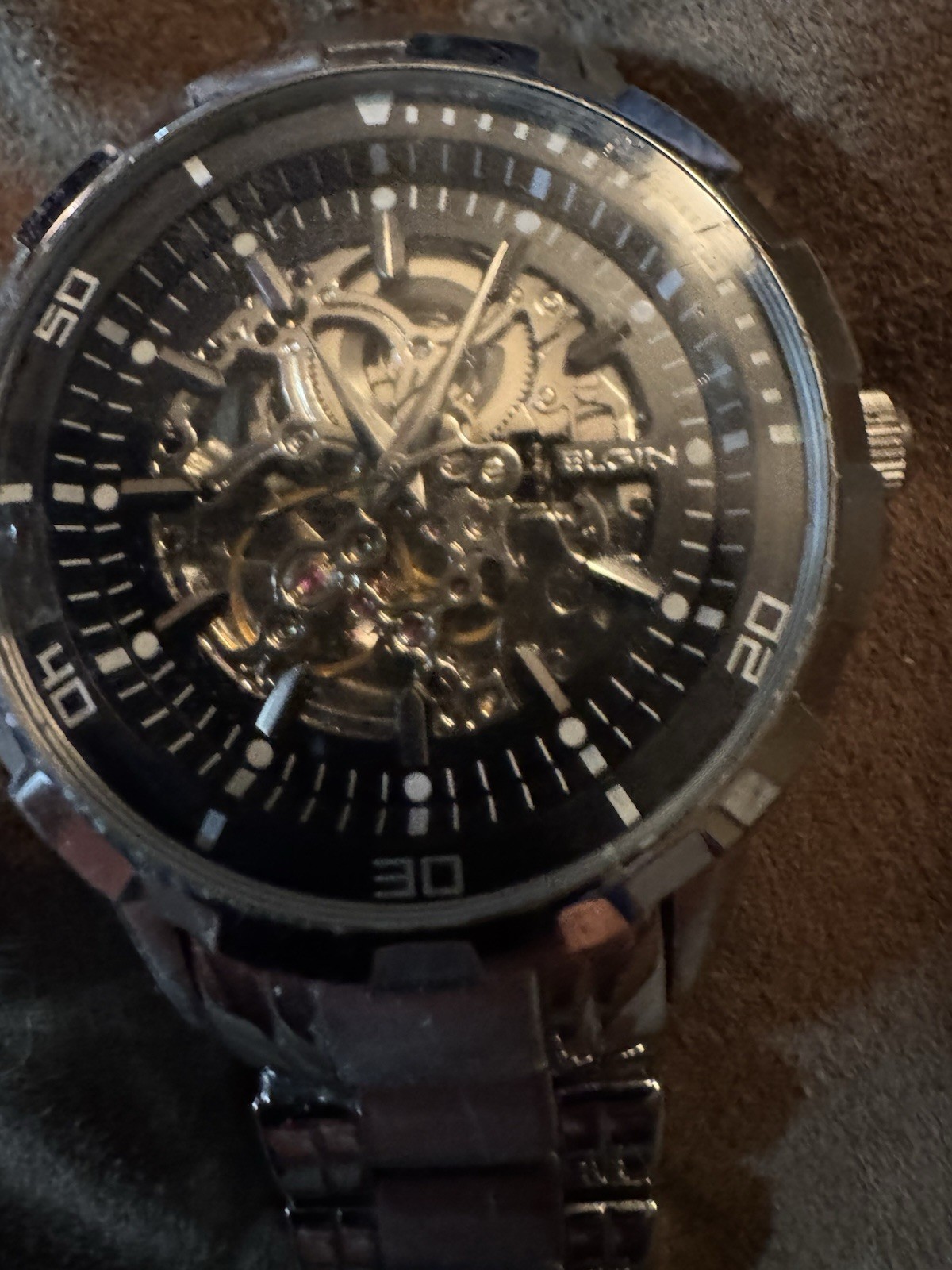 ELGIN”, “BASE METAL BEZEL”, “STAINLESS STEEL BACK”
