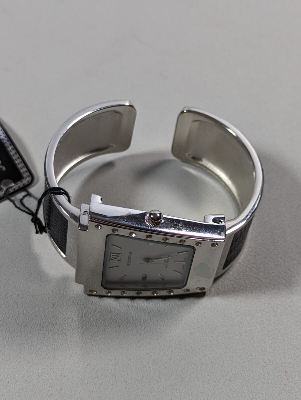 Kareena White Dial Silver Tone Case Black Silver Tone Open Cuff Hinge Band Watch