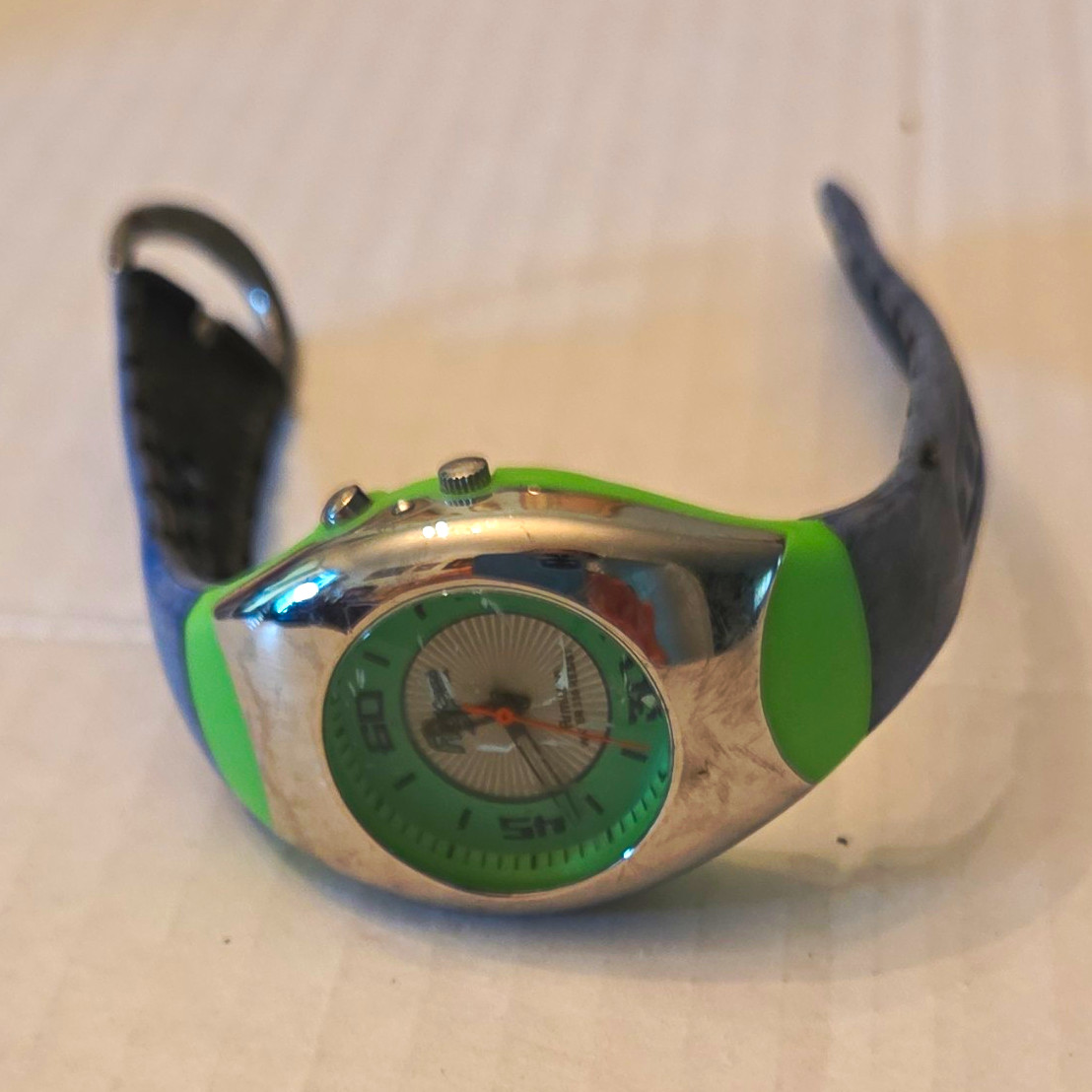 Green & Silver Dial Oval Wristwatch, Black Band, Silver Case, Arabic Numerals