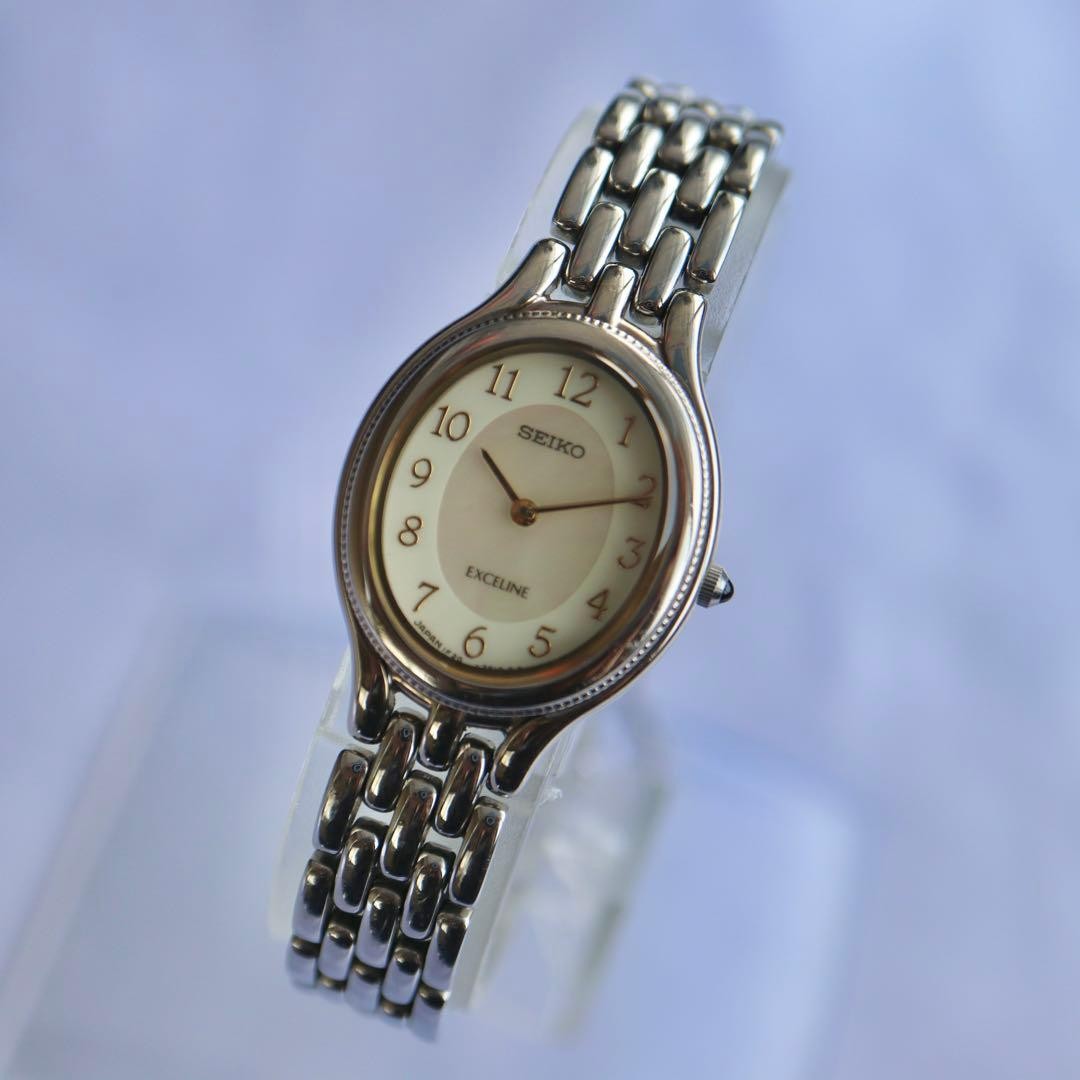 SEIKO Exceline Oval Pink Shell Silver Watch 1676