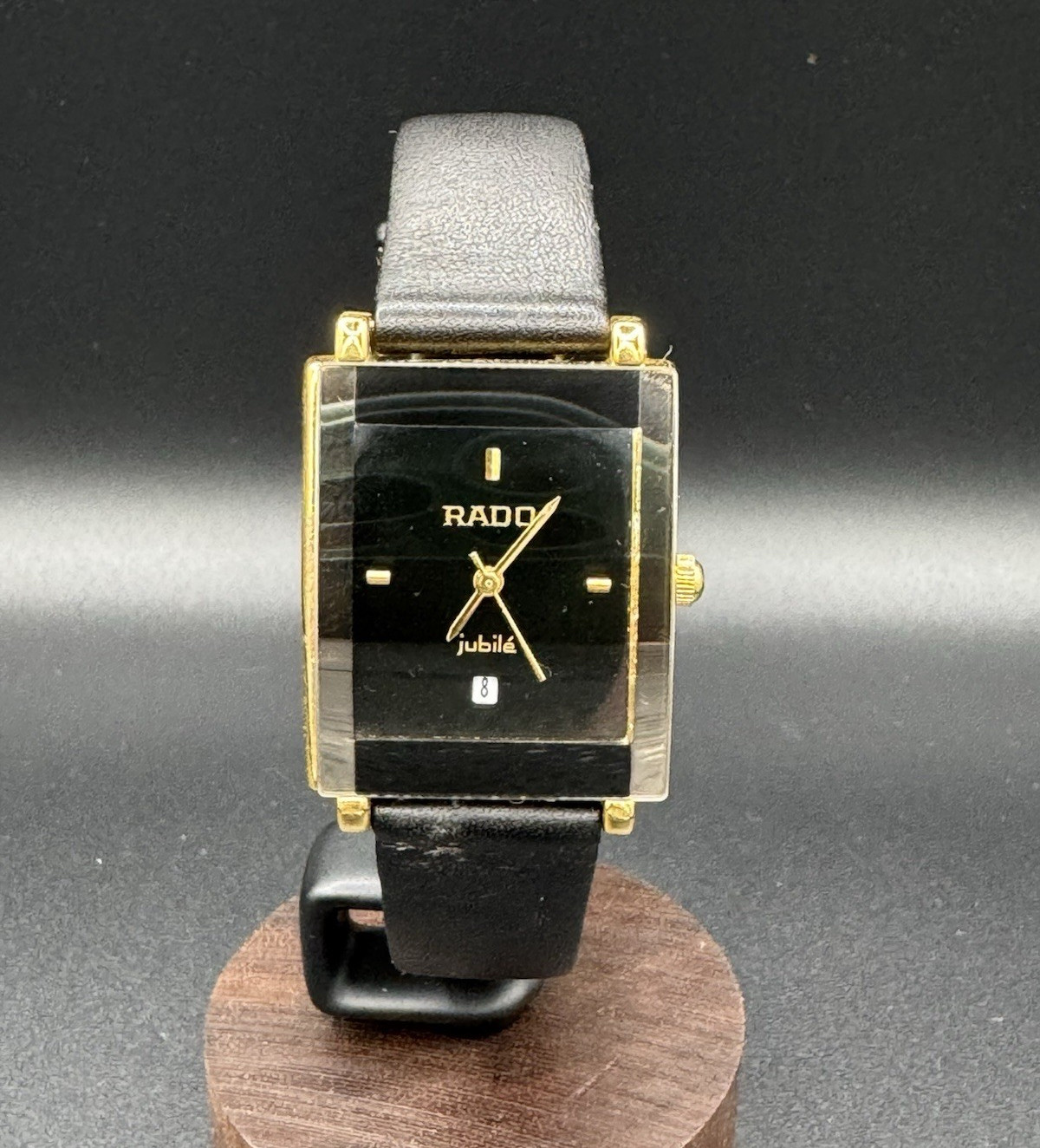 Rado Jubilé Black Dial Gold Tone Rectangular Quartz Date Leather Strap