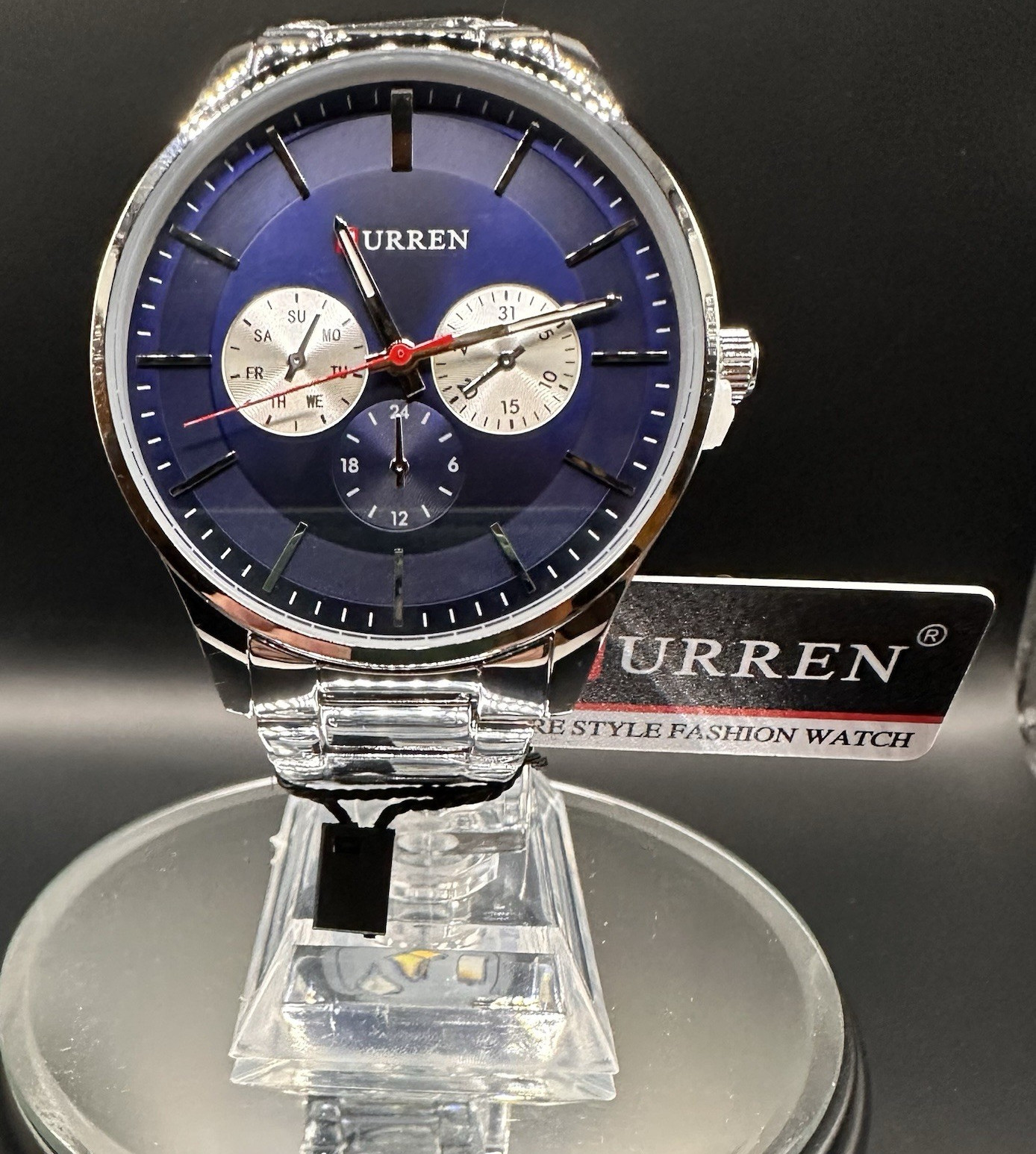 Curren Men’s Silver Metal Bracelet Blue Dial Analog Day/Date 24-Hour Watch