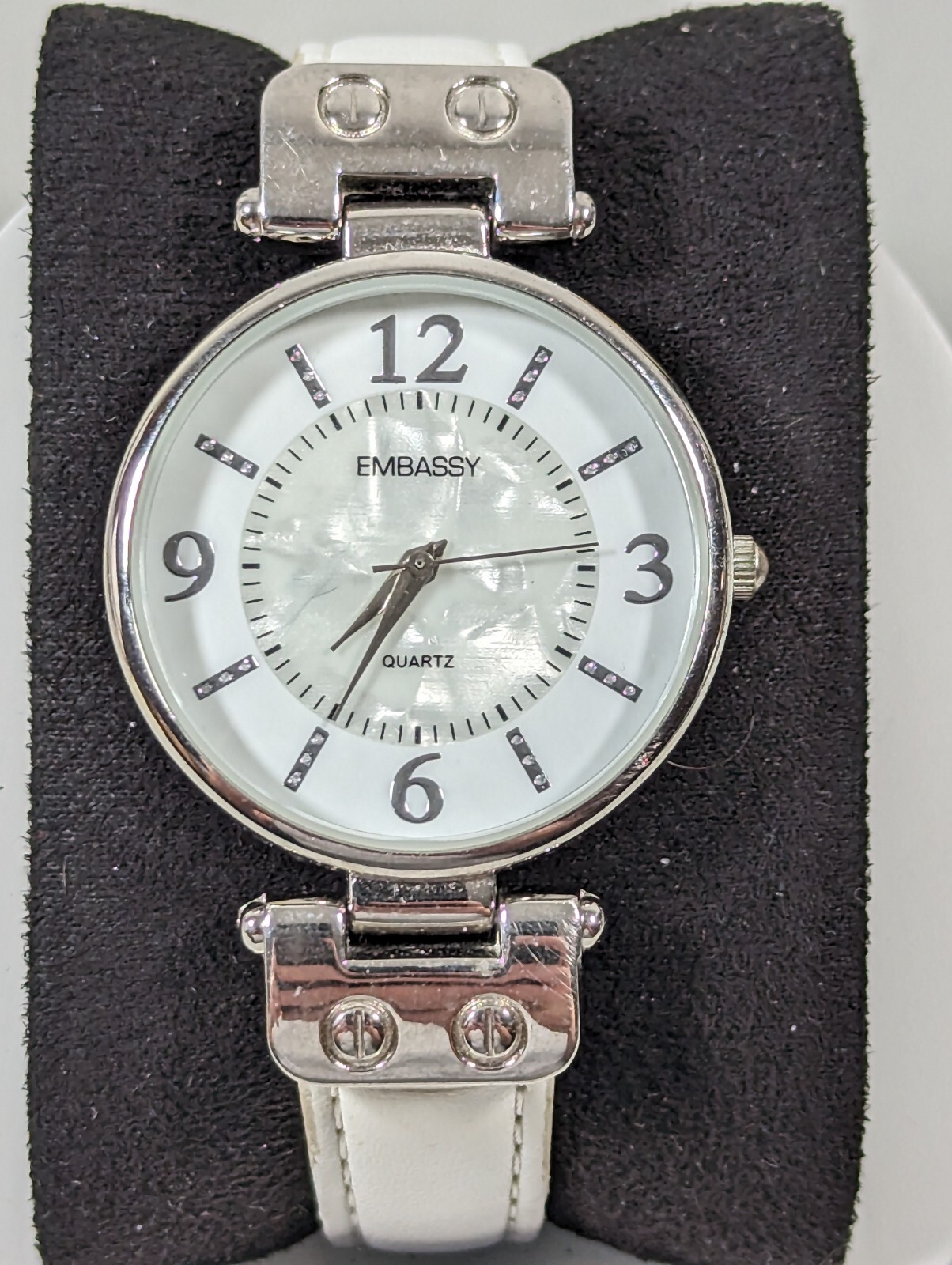 Embassy Womans White Pearlized Dial Silvertone Round Case White Band Watch 7.5in
