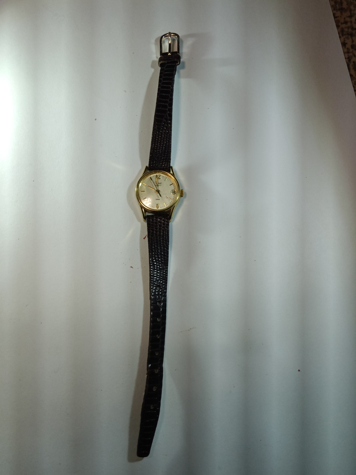 Classic Timex Quartz Analog Watch with a Gold-Tone Round Case