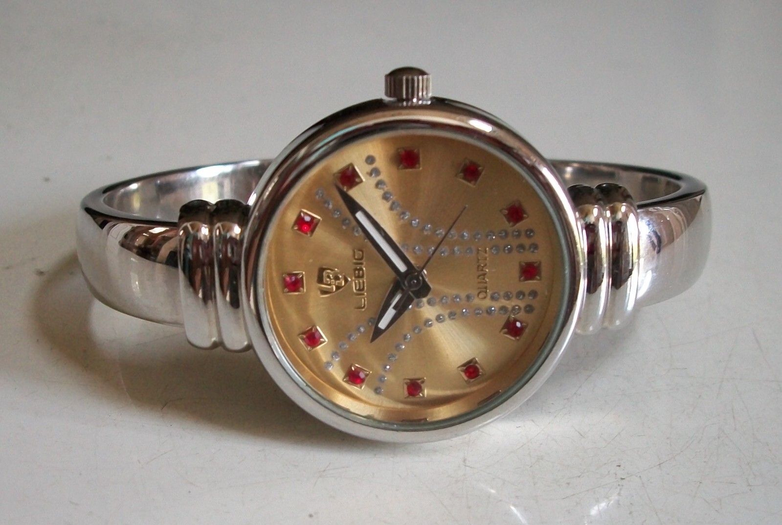 WOMEN’S SILVER FINISH GOLD, SILVER & RED DIAL BANGLE CUFF FASHION CASUAL WATCH