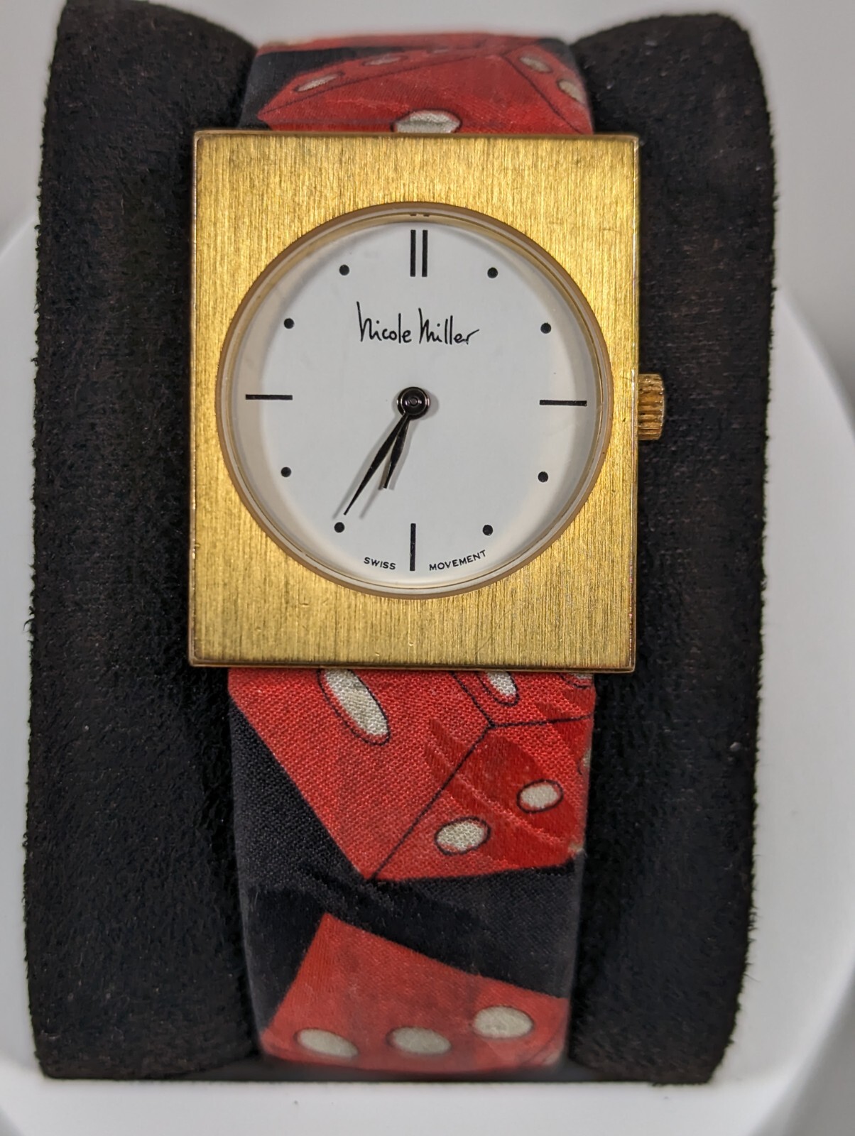 Nicole Miller Swiss White Dial Gold Tone Rectangle Case Black Red Band Watch