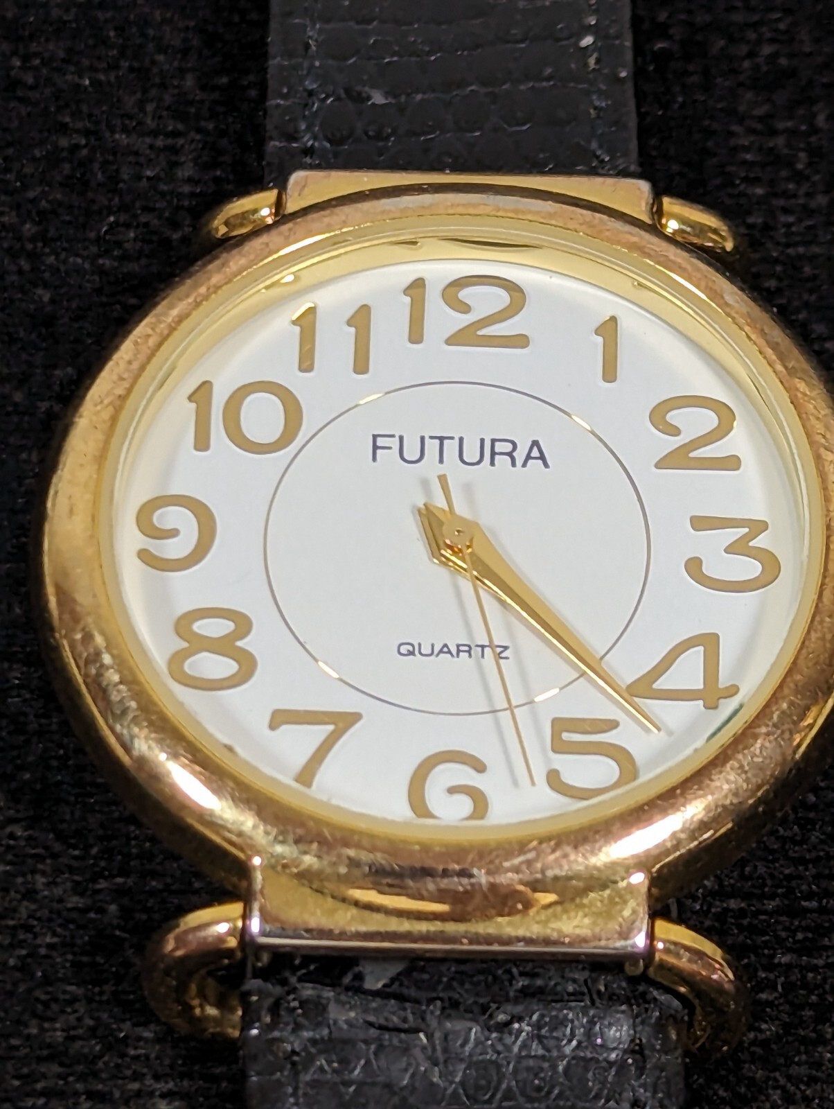 Futura Womans White Dial Round Gold Tone Case Black Leather Band Watch 7.5 In