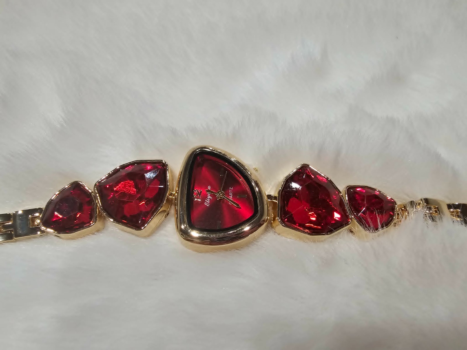 Women watch Color Gold and dark red stones