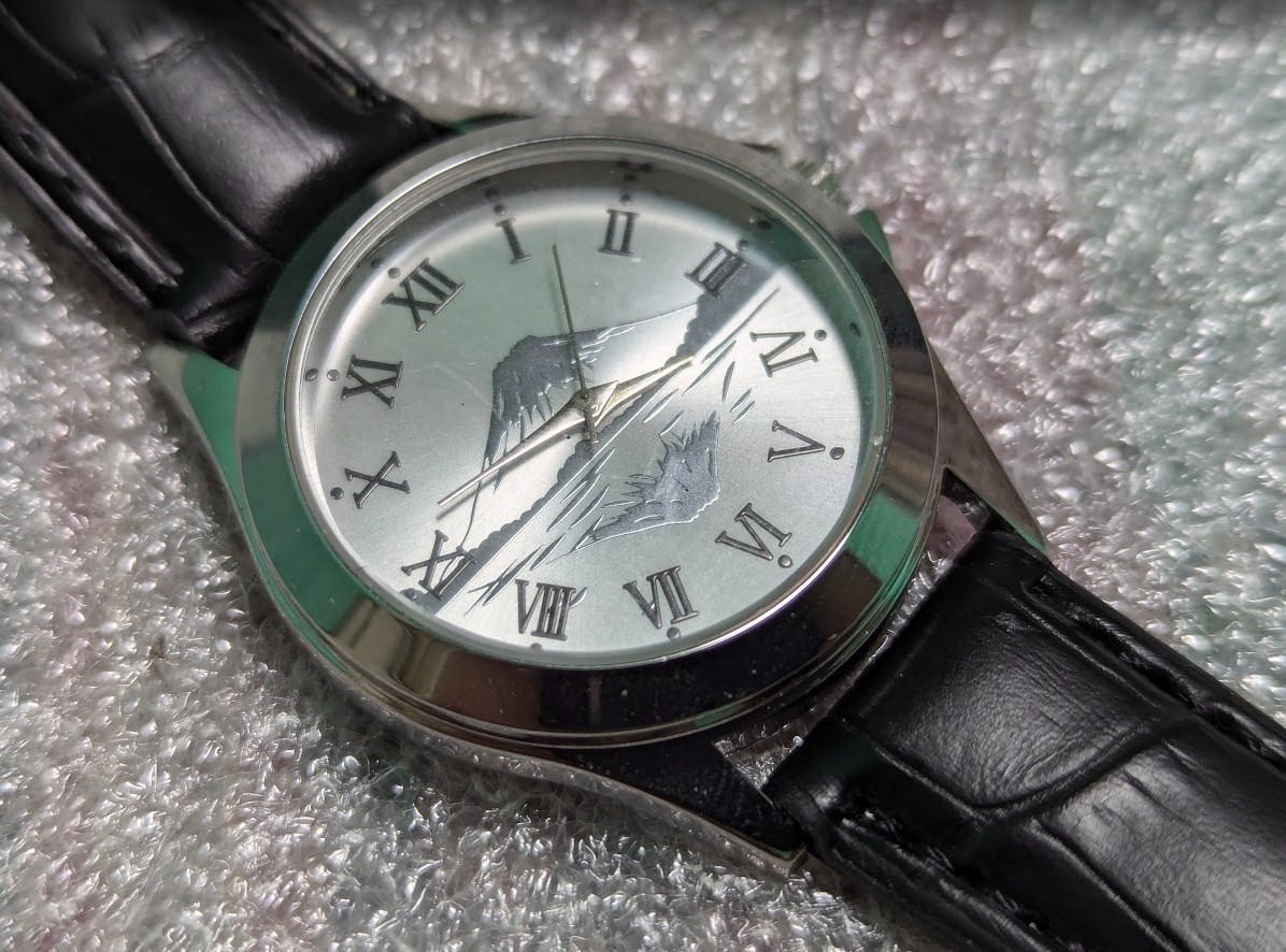 Hokusai pattern watch in silver tone with Mount Fuji image. New battery.