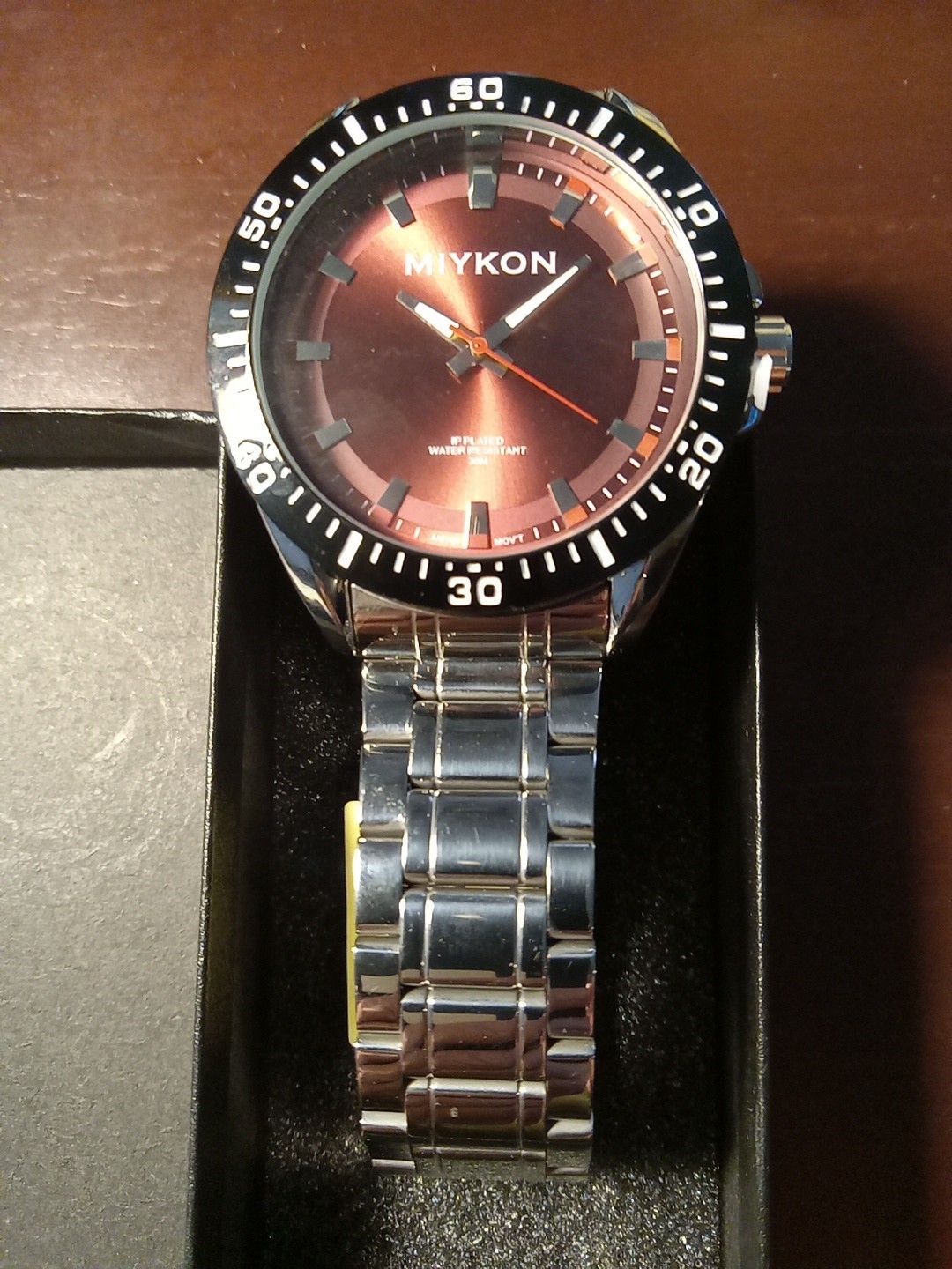 Miykon Wristwatch with A Red Sunray Dial. New with Tags. Never Worn.