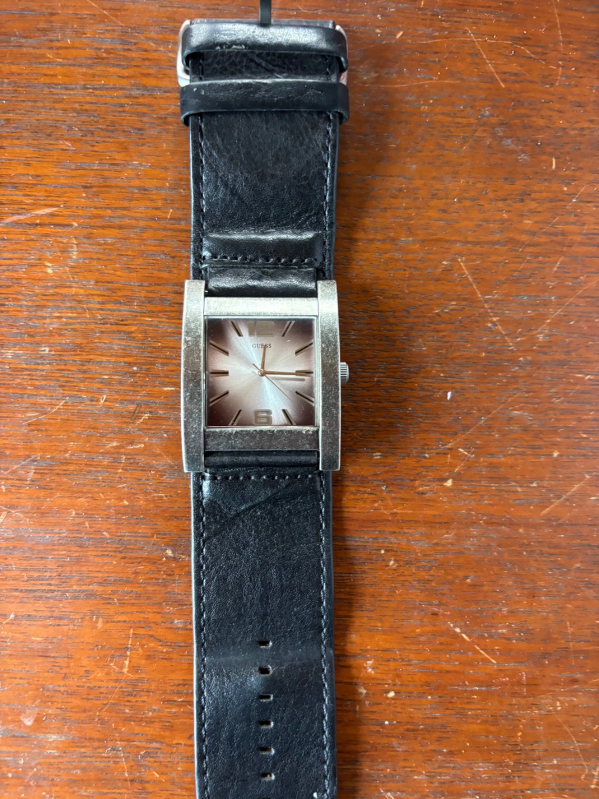 GUESS BRUSHED AGED SILVER TONE,BLACK LEATHER CUFF BAND WATCH U75016G1
