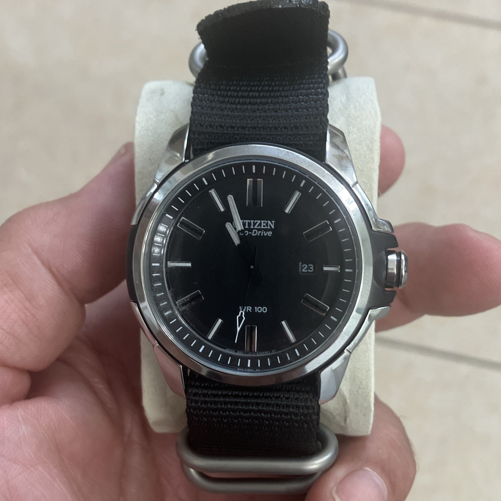 Citizen Eco-Drive Mens Date Black Dial WR100 Silver SS Case Black Nylon Strap