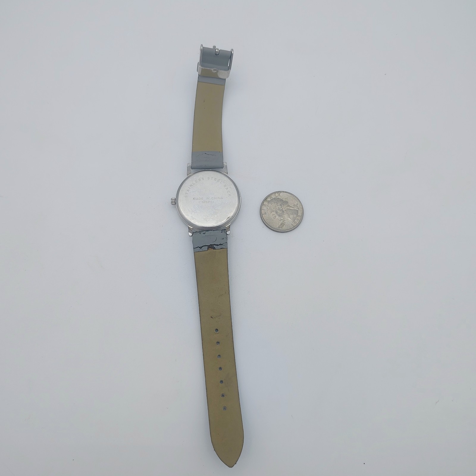 Silvertone Bezel Gray And White Striped Dial Gray Band NEW BATTERY