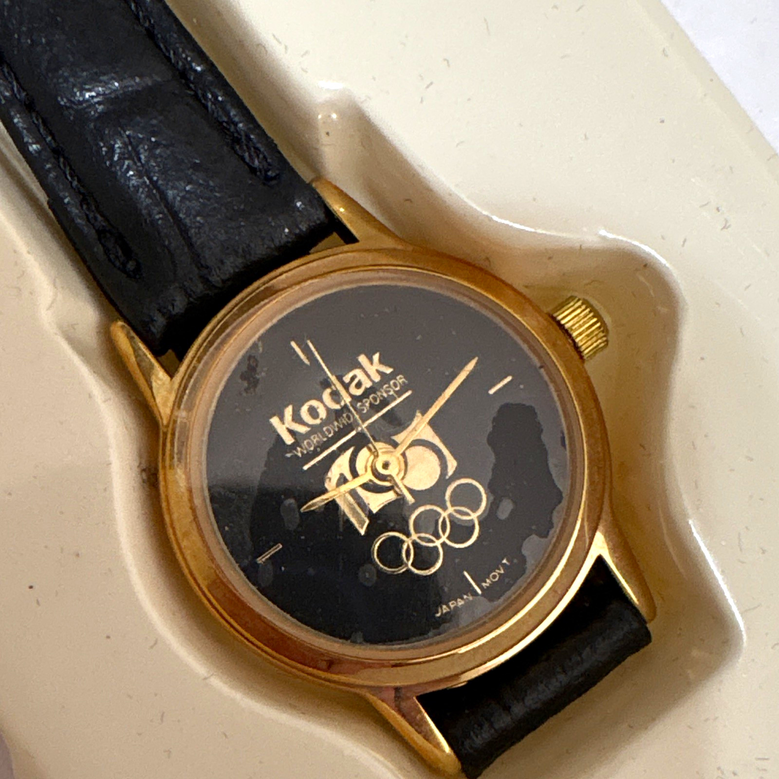 Kodak 100 Olympic Quartz Analog Watch Black Dial Gold Tone Case Leather Strap