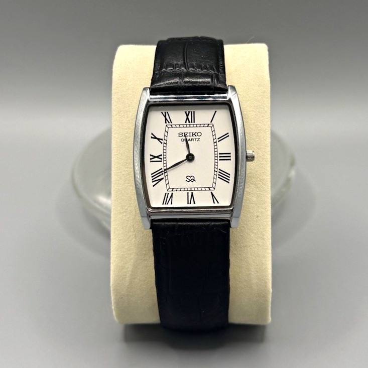 Seiko Quartz Vintage Dress Tonneau Silver Case White Roman Dial Black Leather