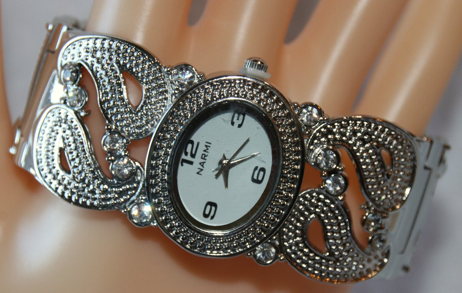 Silver Narmi Cuff Watch, clear rhinestones, quartz movement, spring hinge