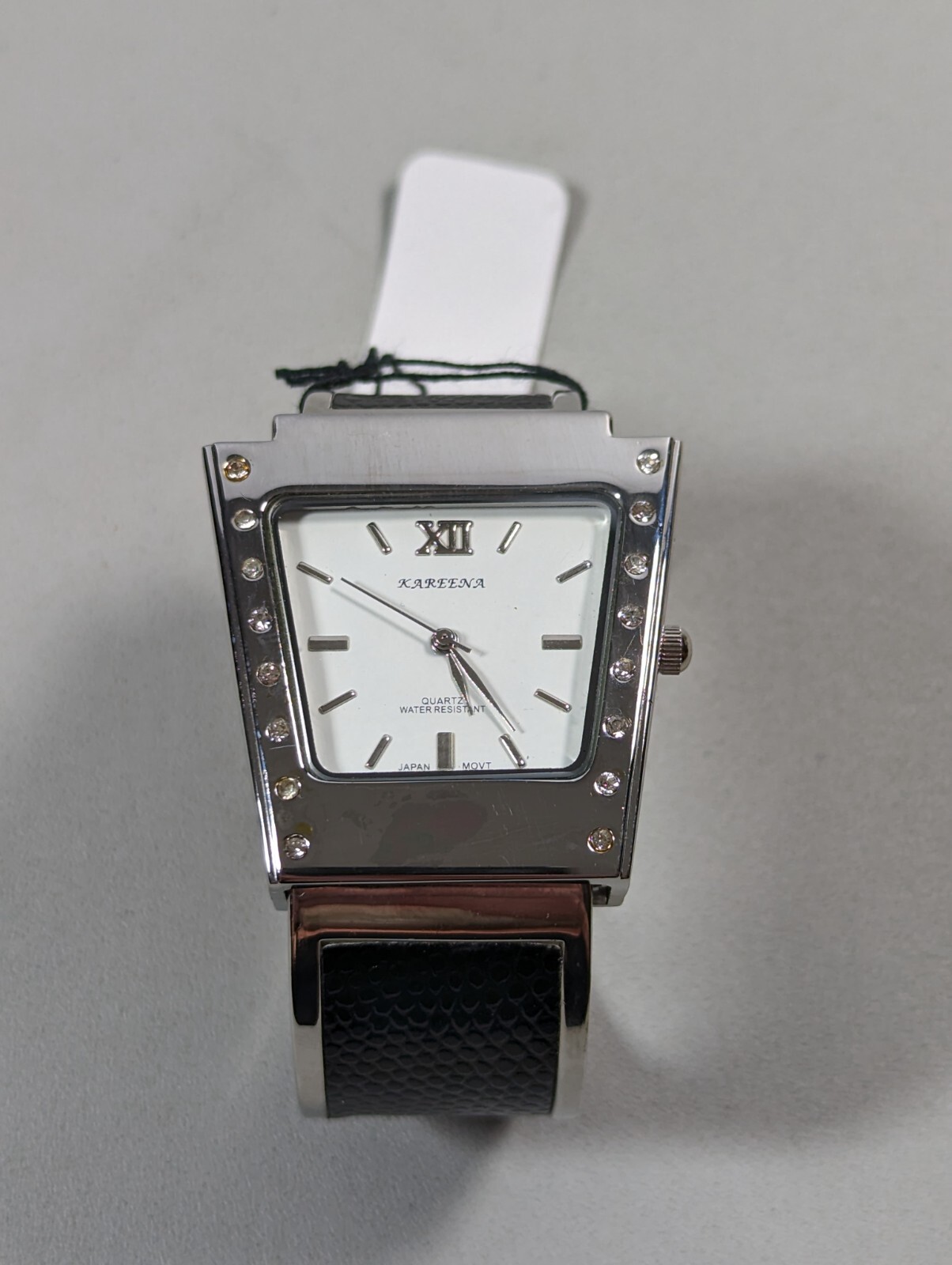 Kareena White Dial Silver Tone Case Black Silver Tone Open Cuff Hinge Band Watch