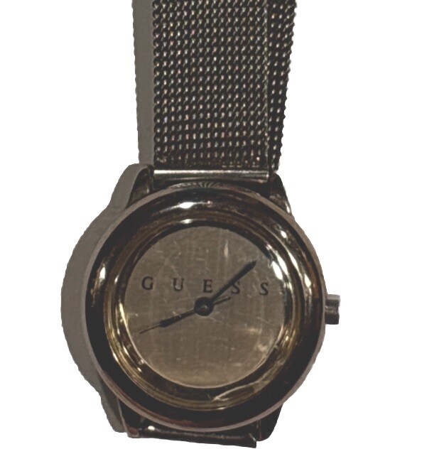 1996 GUESS numberless face watch. silver w adjustable mesh band. new battery.